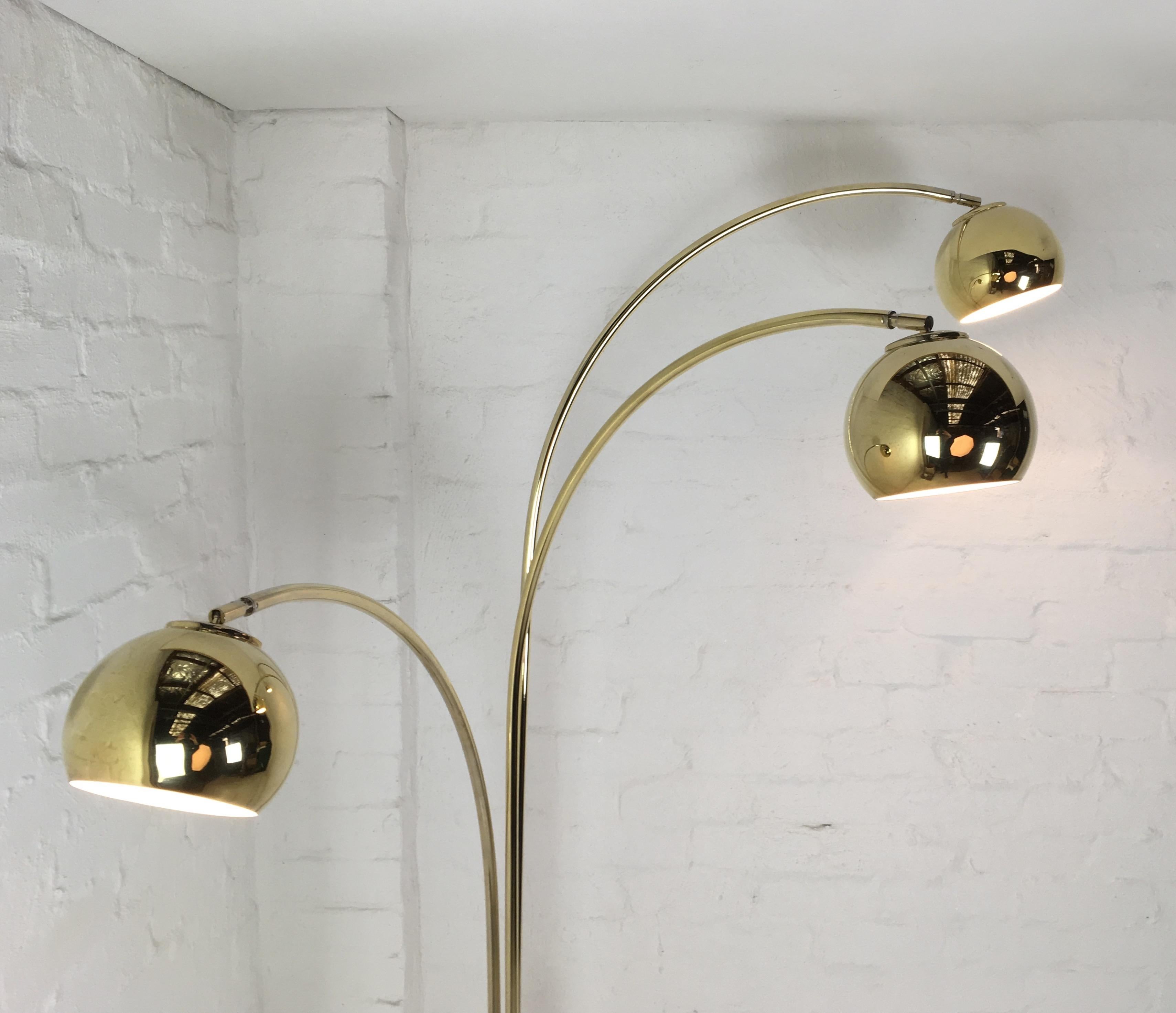 This Classic brass three-arm floor lamp has been fully refurbished, rewired, tested and tagged. It’s ready to plug in and bring some serious class to your living space. 

The arms each move at least 180 degrees left or right with limits once