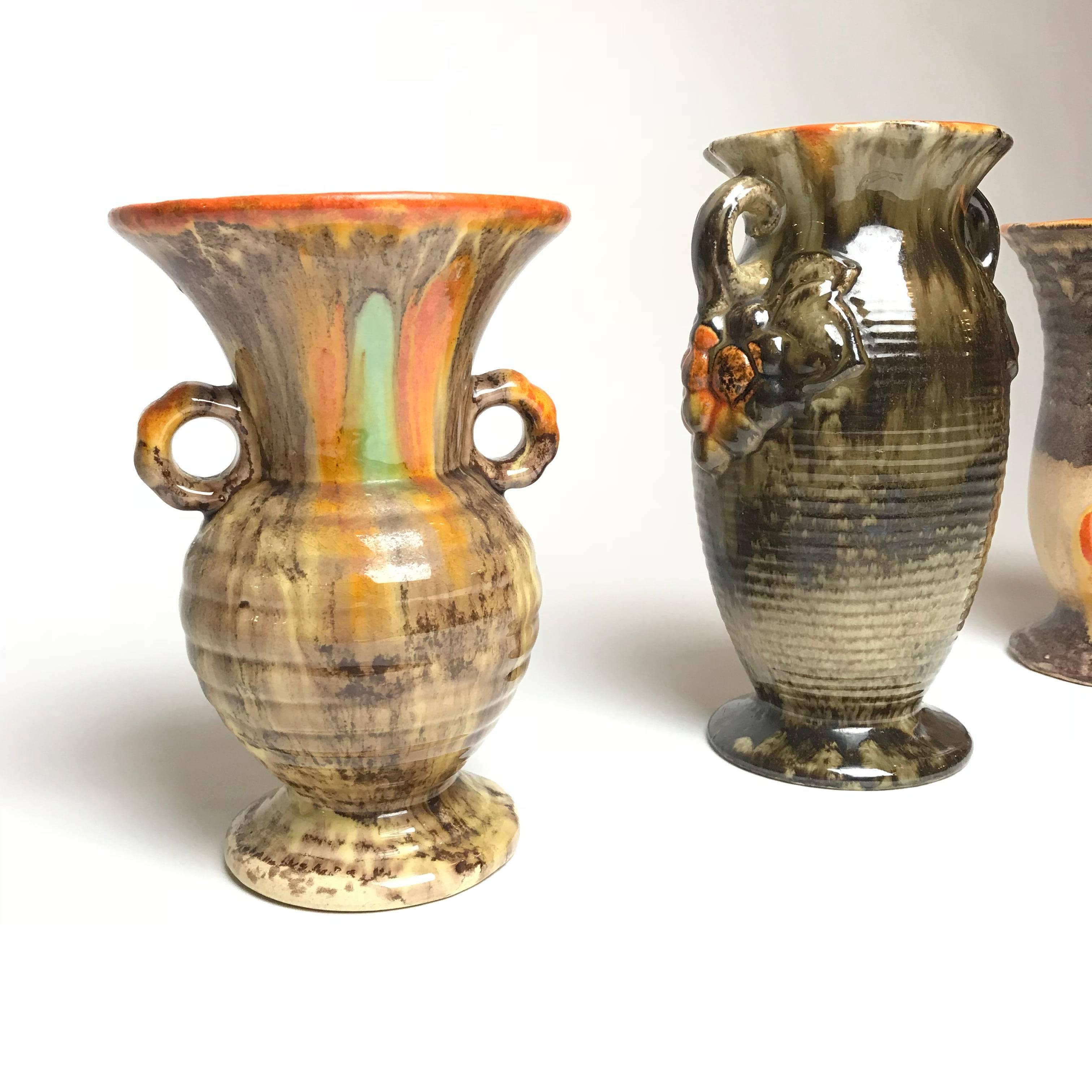 Three unique Art Deco handmade glazed vases from the famous pottery region Thuringia. Thuringia is the home of the most renowned ceramic manufactories in Germany. Very decorative vases with powerful colors.

Year of production: