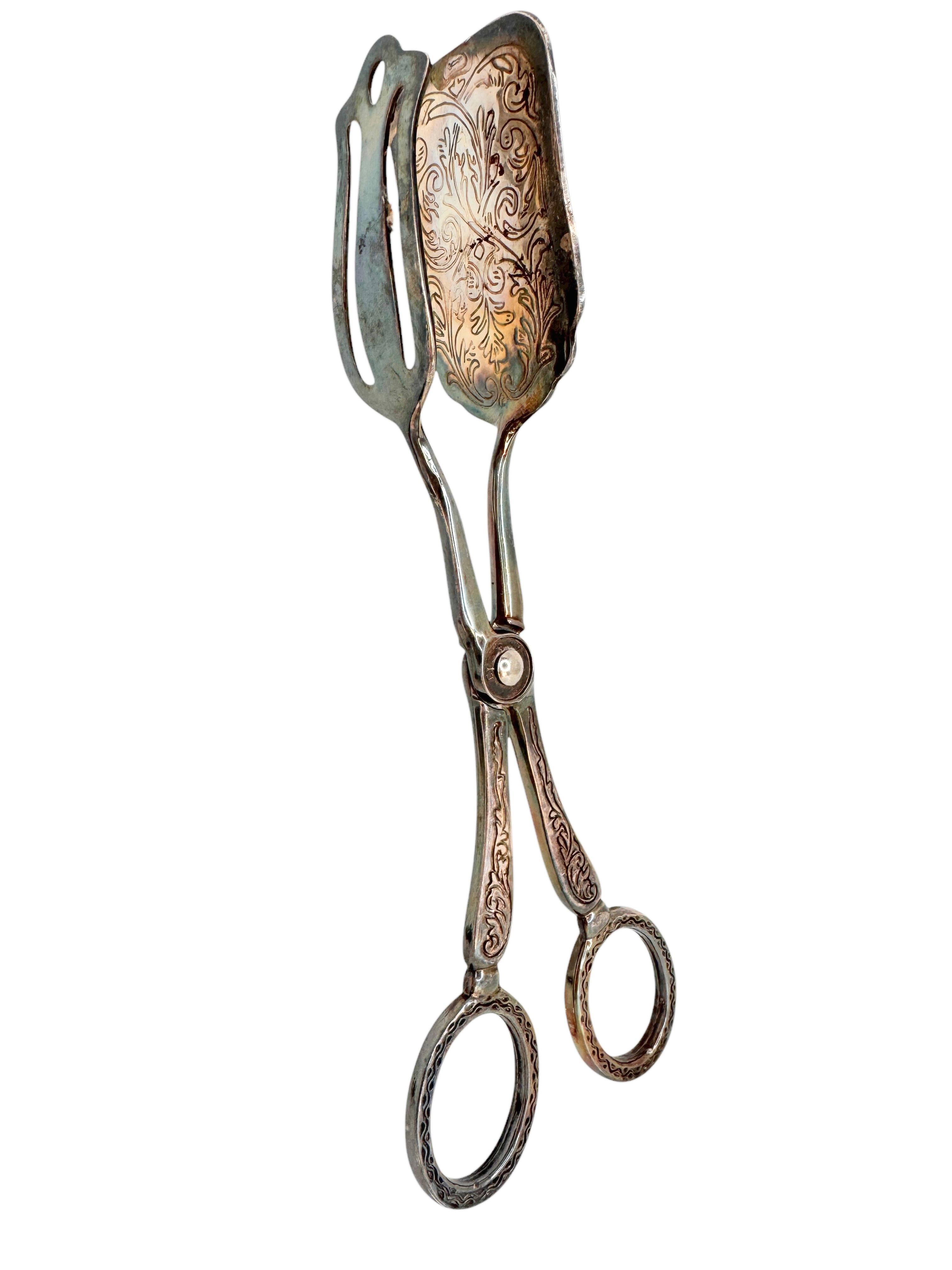 A set of three beautiful Art Nouveau serving tongs for pastry, cake, candy or meat. These serving piece are in a beautiful design. Made of silver plated metal, it will make a nice addition to any table. The size told in dimensions section refers to
