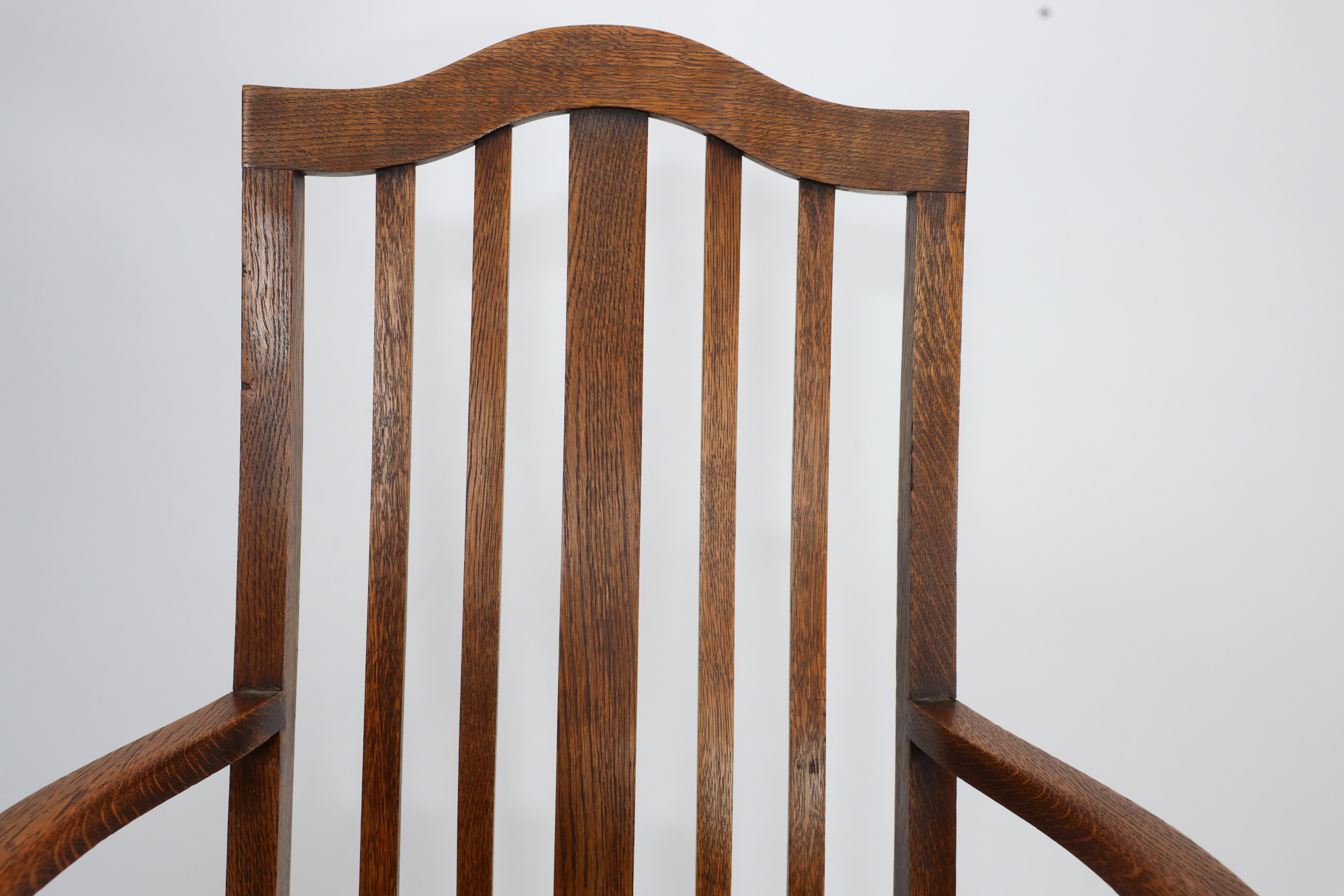 Three Arts and Crafts oak dining armchairs For Sale 1