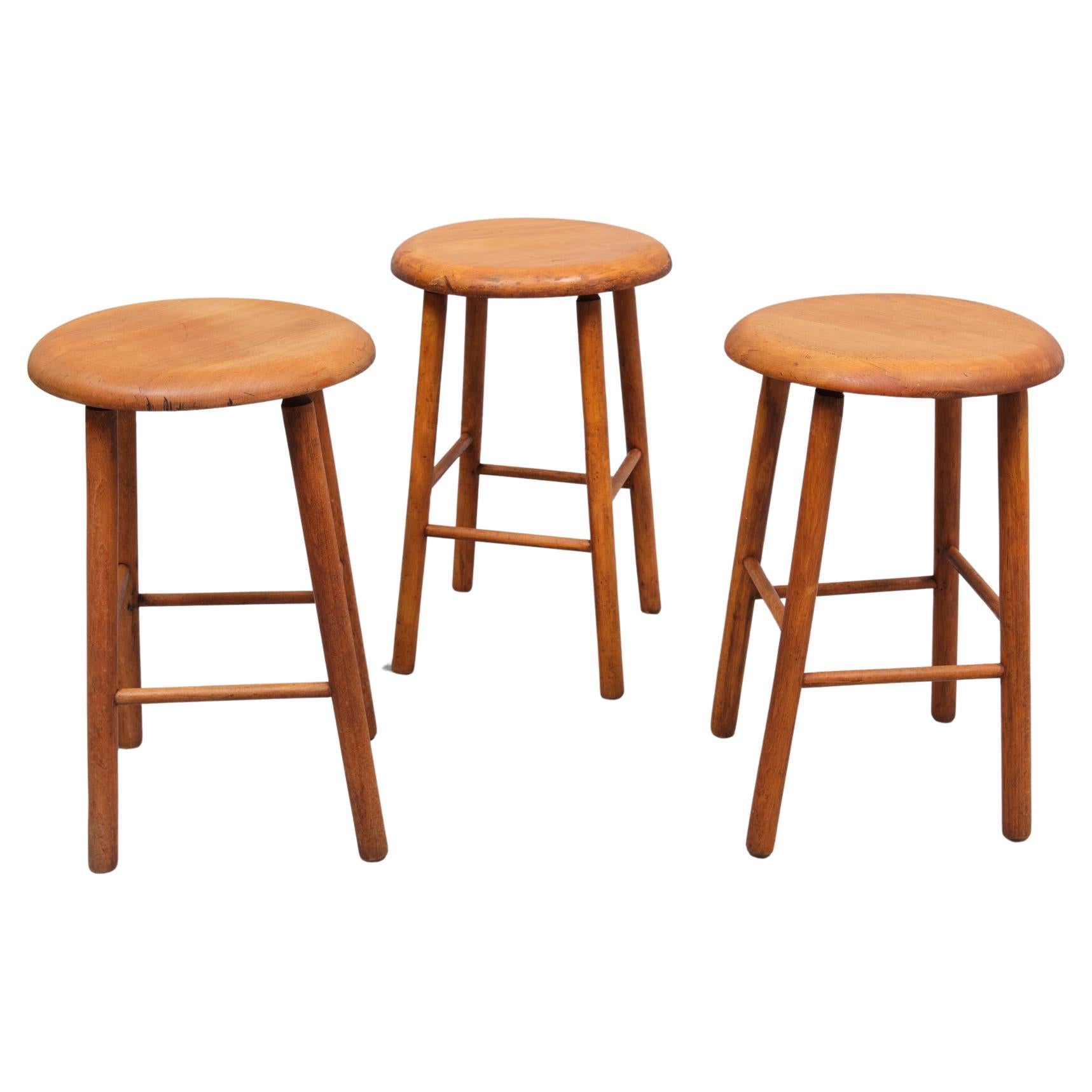 Three workingmen s Beechwood stools . 1950s Holland 