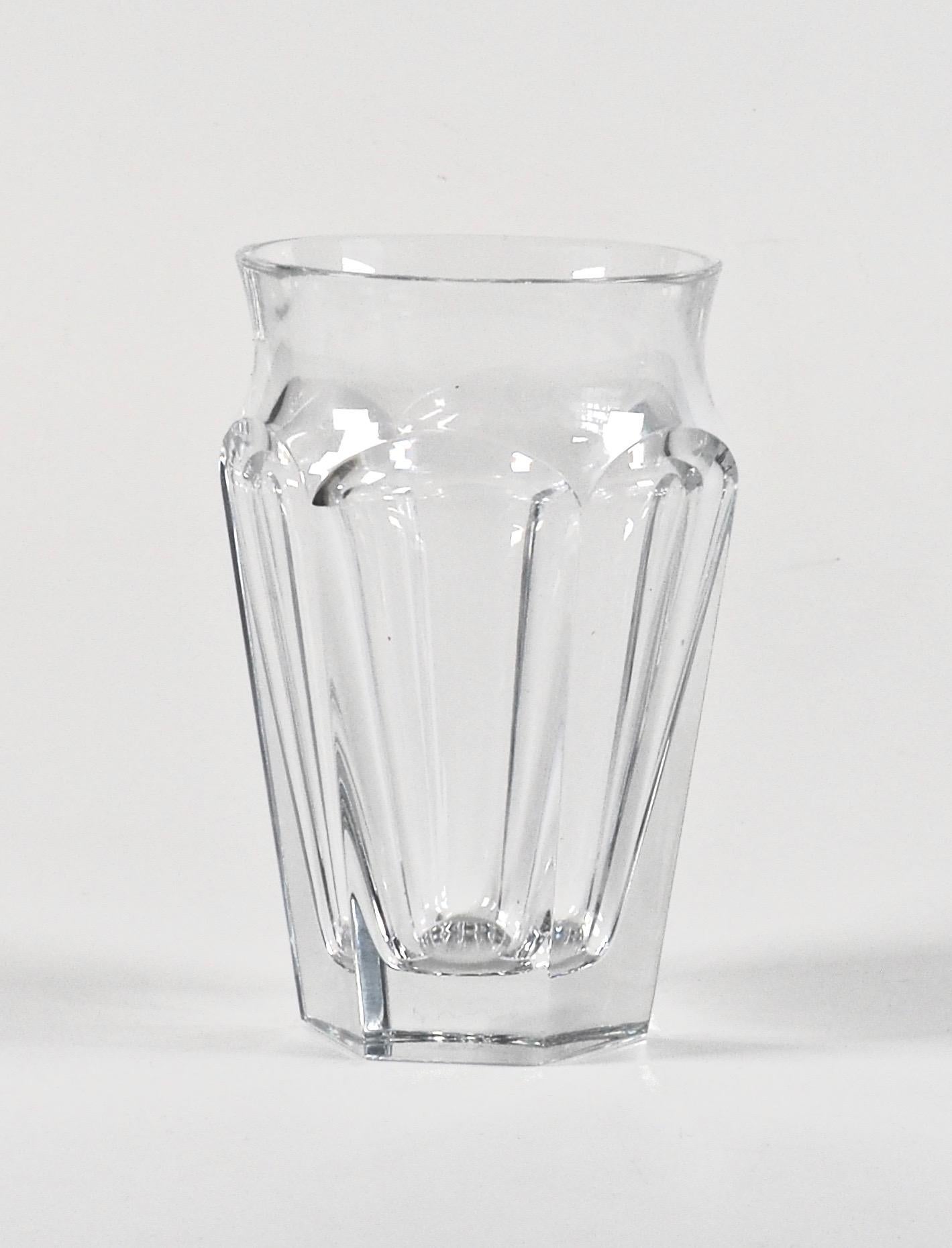 A trio of elegant cut crystal Baccarat ‘Nelly’ vases with tapering hexagonal bodies and flared bevelled rims. Signed, Baccarat, France to base. 
No longer in production. 

Dimensions: H 12.5 x W 8 cm.
 