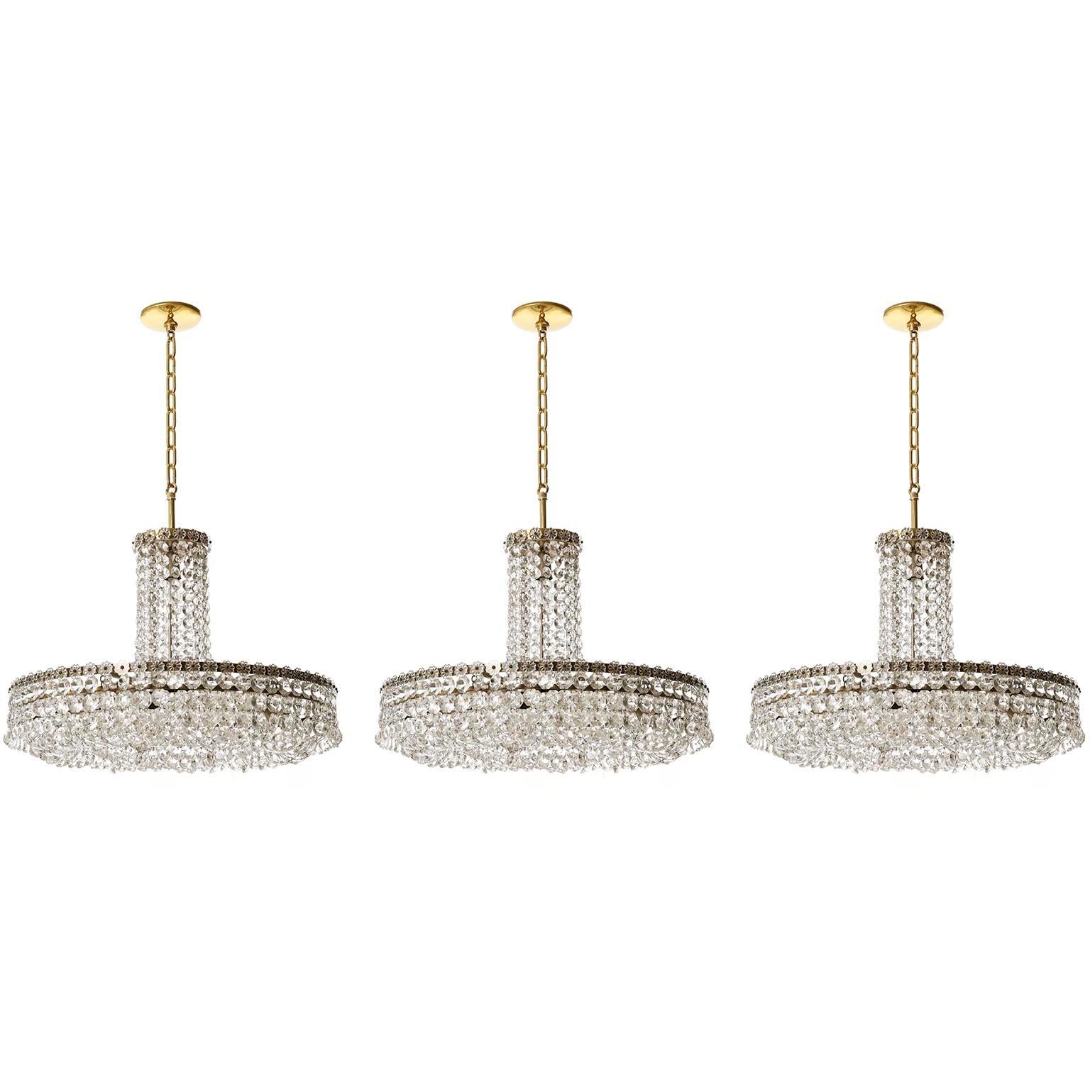 One of three impressive chandeliers, pendant lights model no. 3330 by Bakalowits und Soehne, Austria, manufactured in midcentury, circa 1960.
The price is per lamp. They will are individually, as pair or as set of three.
The fixtures are handmade