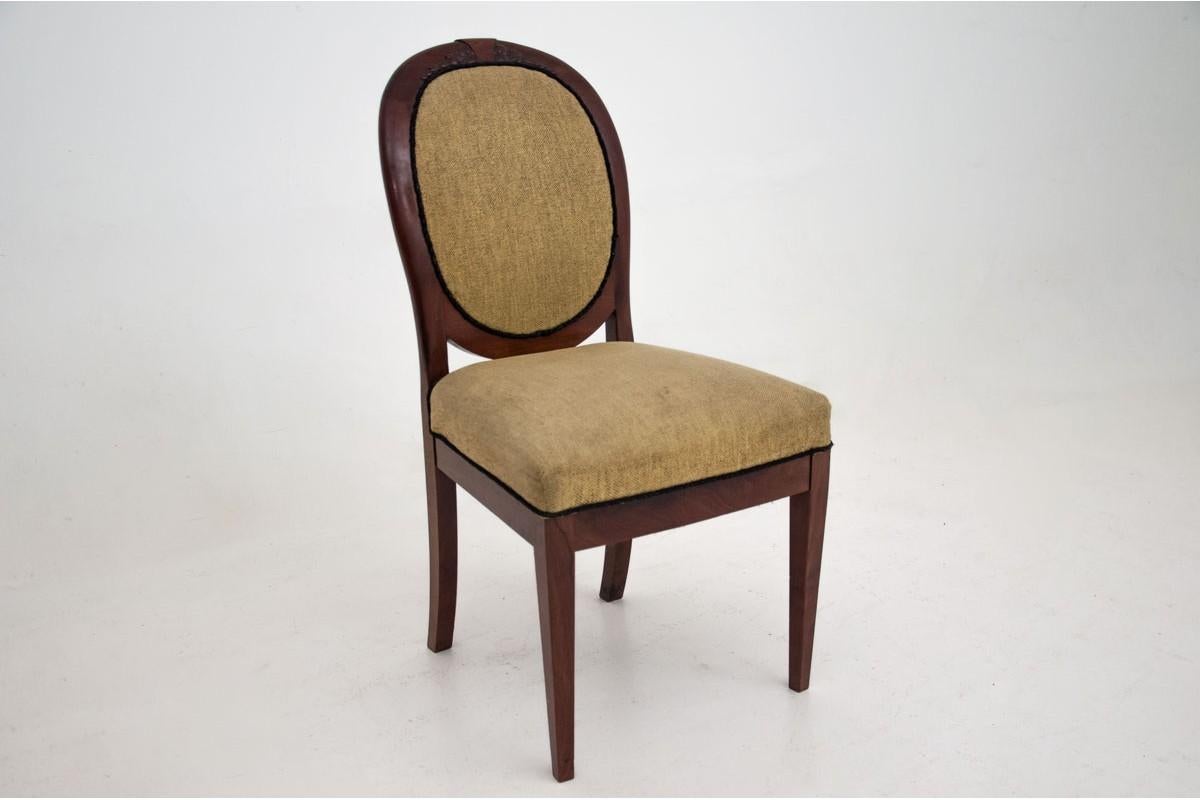 Stylish, antique set of three chairs was created at the end of the 19th century from mahogany wood. Seats and backs upholstered in fabric, all with a beautiful round shape. Straight legs, subtle sculpted application for sewing the backrest. Very
