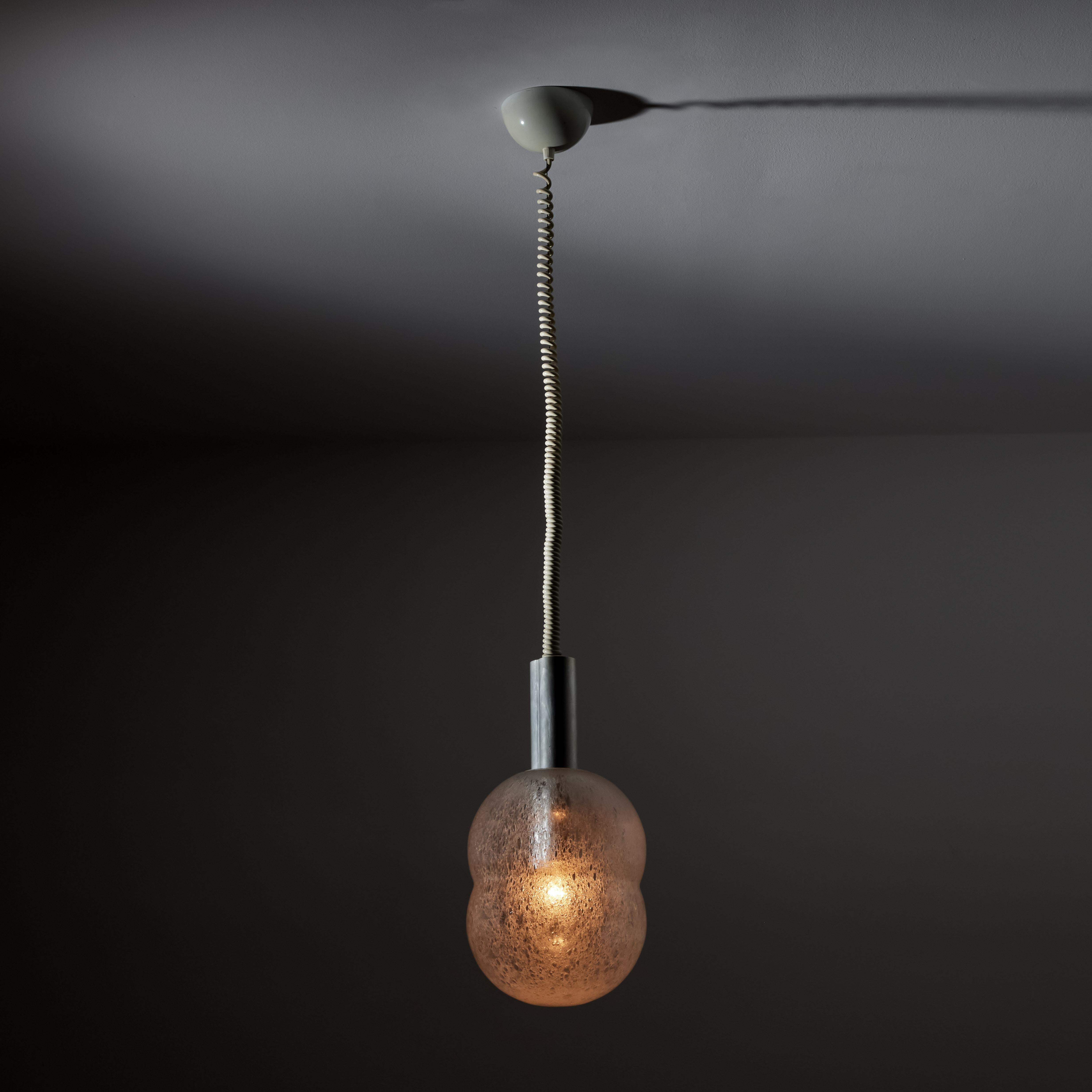 Two Bilobo pendants by Afra & Tobia Scarpa for Flos. Designed and manufactured in Italy, circa 1960's. Glass, aluminum, painted metal, vinyl cord. Original canopy, wired for U.S. Standards. We recommend one E27 100w maximum bulb per socket. Bulbs