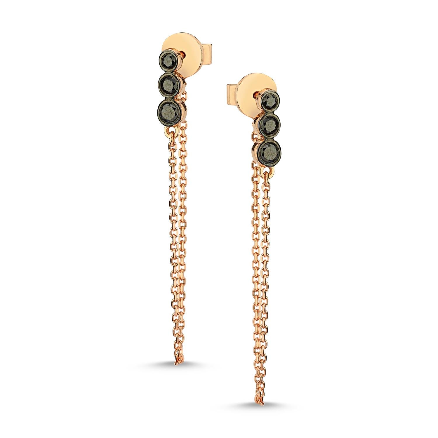 Three black diamond chain earring (single) with 14k rose gold by Selda Jewellery

Additional Information:-
Collection: Thunder Collection
14k Rose gold
0.11ct Black diamond
Length 3.5cm