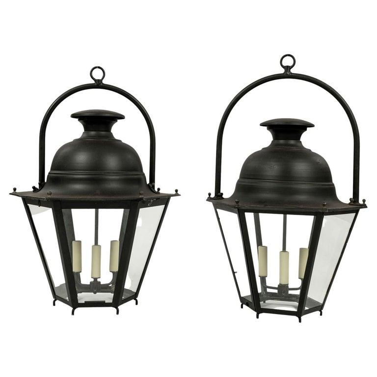 Three black-painted hexagonal street lanterns from the South of France. Sold unwired, but may be wired for electricity or fitted for use with gas for an additional cost. Lanterns sold together as a set of three priced $11,400 ($3,800 each) for the