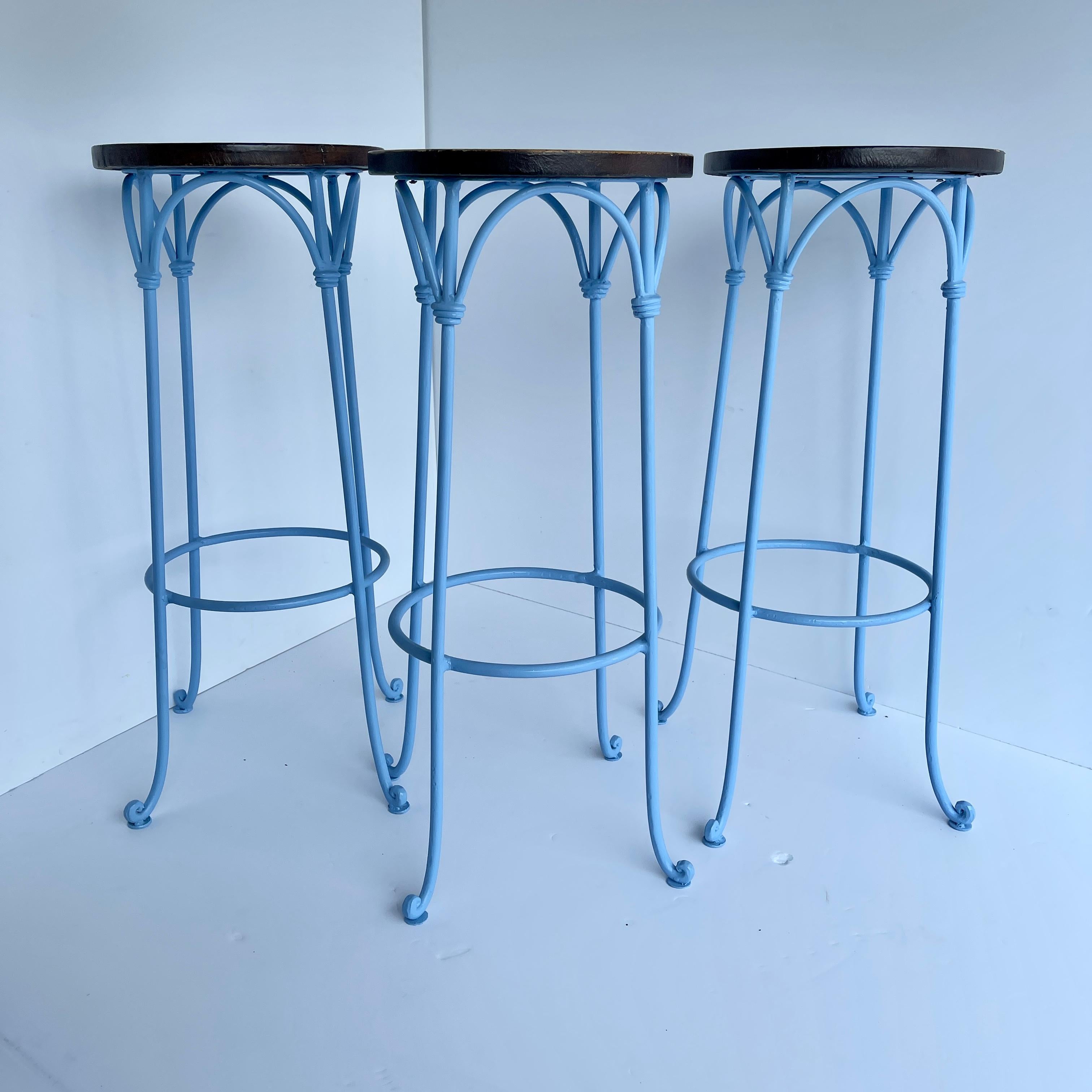 Iron and leather barstools set freshly powder coated in soft Tiffany-blue. 
These modern stools have just been kicked up a notch with cheeky blue tall slender legs. The stitched leather top is a perfect warm contrast. Comfortable with clean lines,