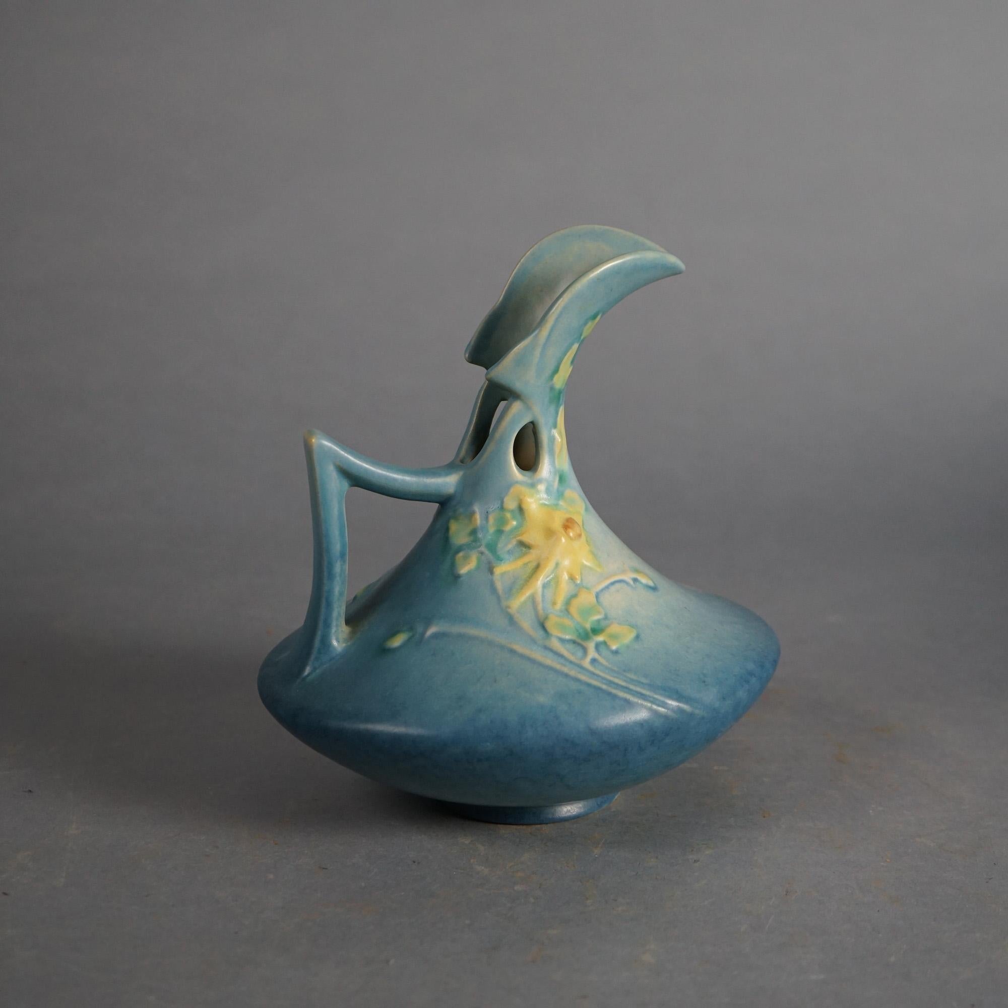 Three Blue Roseville Art Pottery Items with Columbine Pattern Mid 20thC

Measures- Ewer 7.75''H x 6.75''W x 6''D