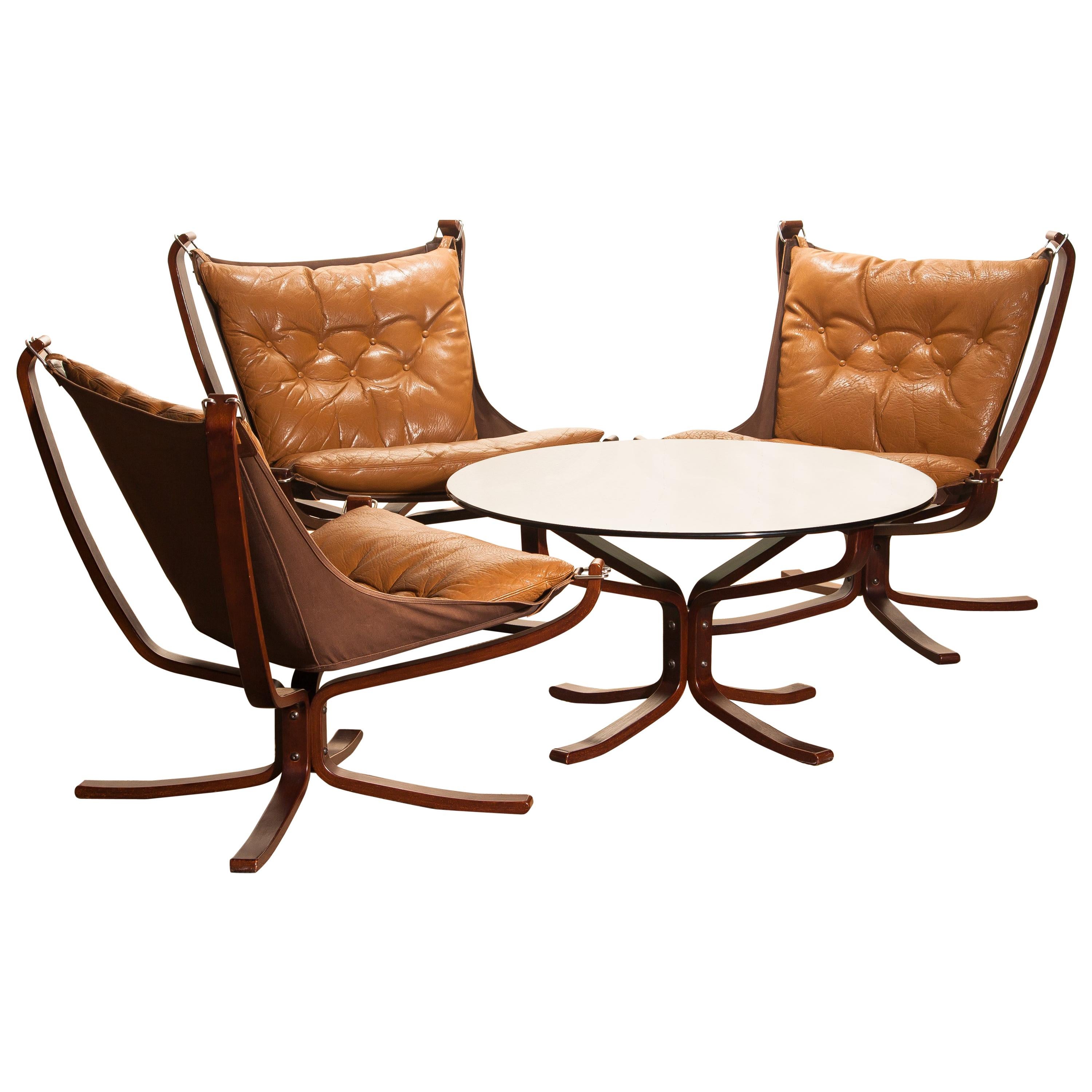 Three Camel Leather 'Falcon' Lounge Chairs and Coffee Table by Sigurd Ressell