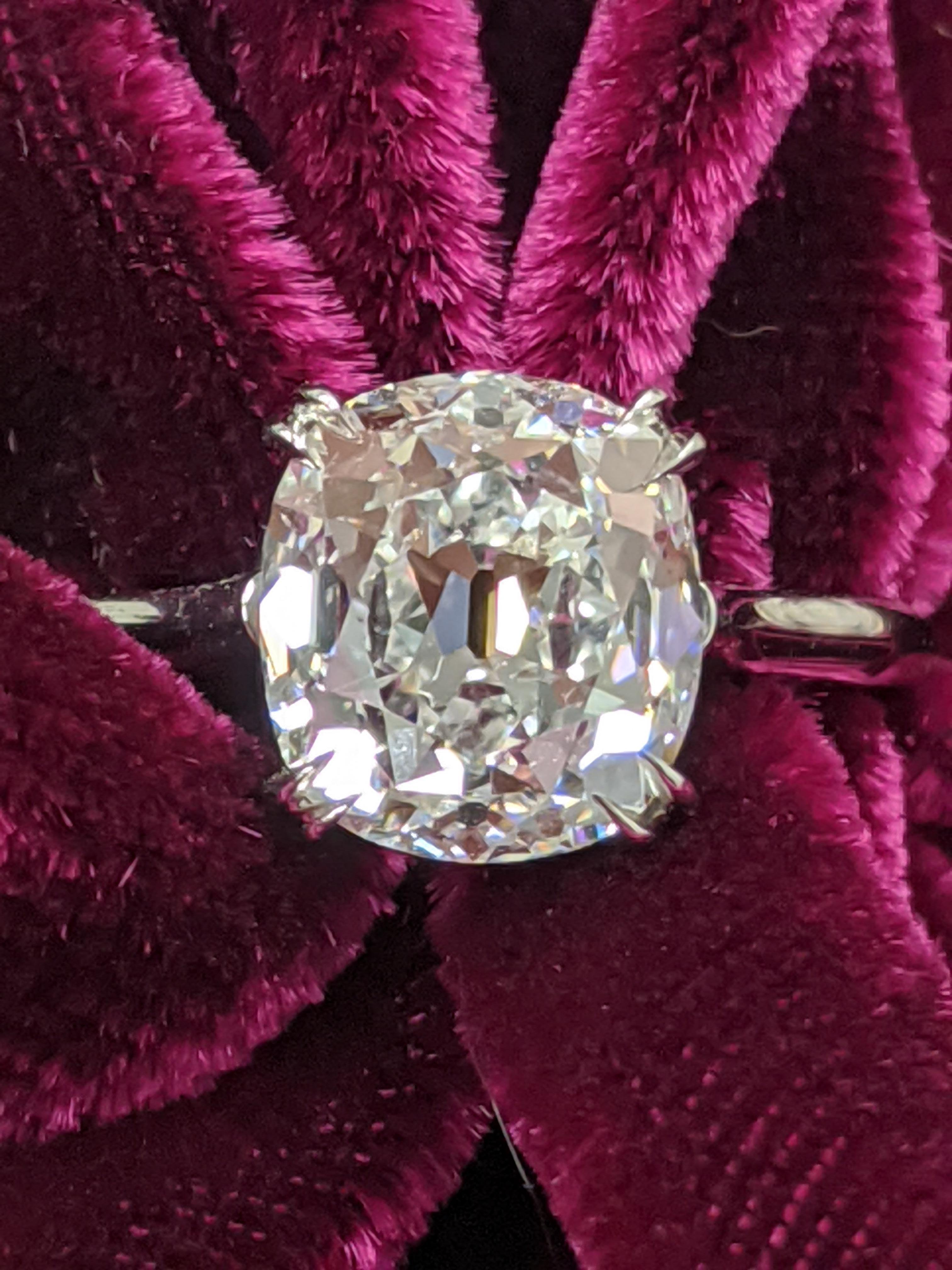 This 3.06 carat D VS1 Antique style cut Cushion Diamond is mounted in a classic platinum solitaire and comes with a GIA grading report.  Our diamond cutting office in New York City is one of the last remaining in the United States and specializes in