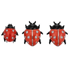 Three Cartier London and Paris Diamond Coral Enamel Platinum Ladybug Brooches