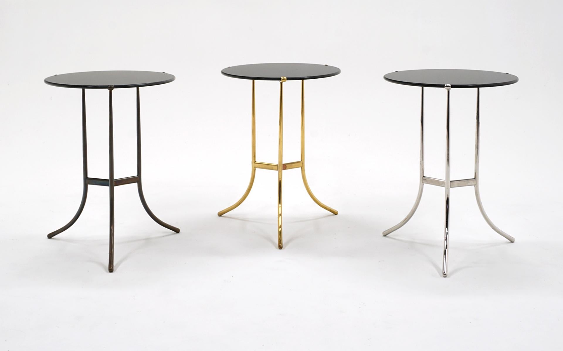 Cedric Hartman end / side / occasional tables.  One is frame is brass, one is bronze (photos look too dark on that one.  It's a beautiful finish) and one is chromed plated brass.  All three tops are black granite and each is signed on the underside.