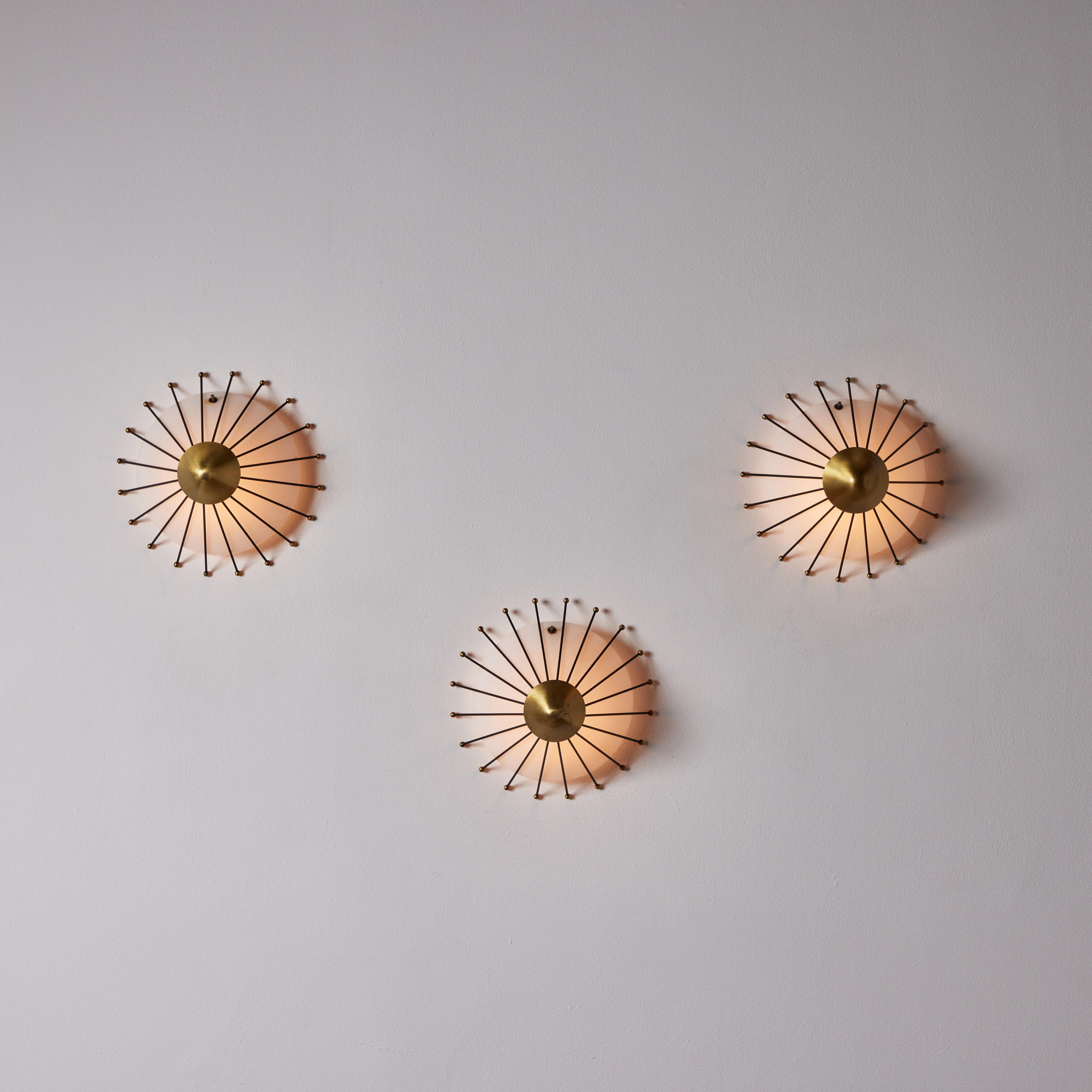 Three Sconces by Stilux. Manufactured in Italy, circa 1950s. Opal glass, painted metal, brass. Custom brass ceiling plates. Wired for U.S. standards. We recommend three E27 25w maximum bulbs per fixture. Bulbs not provided. Priced and sold