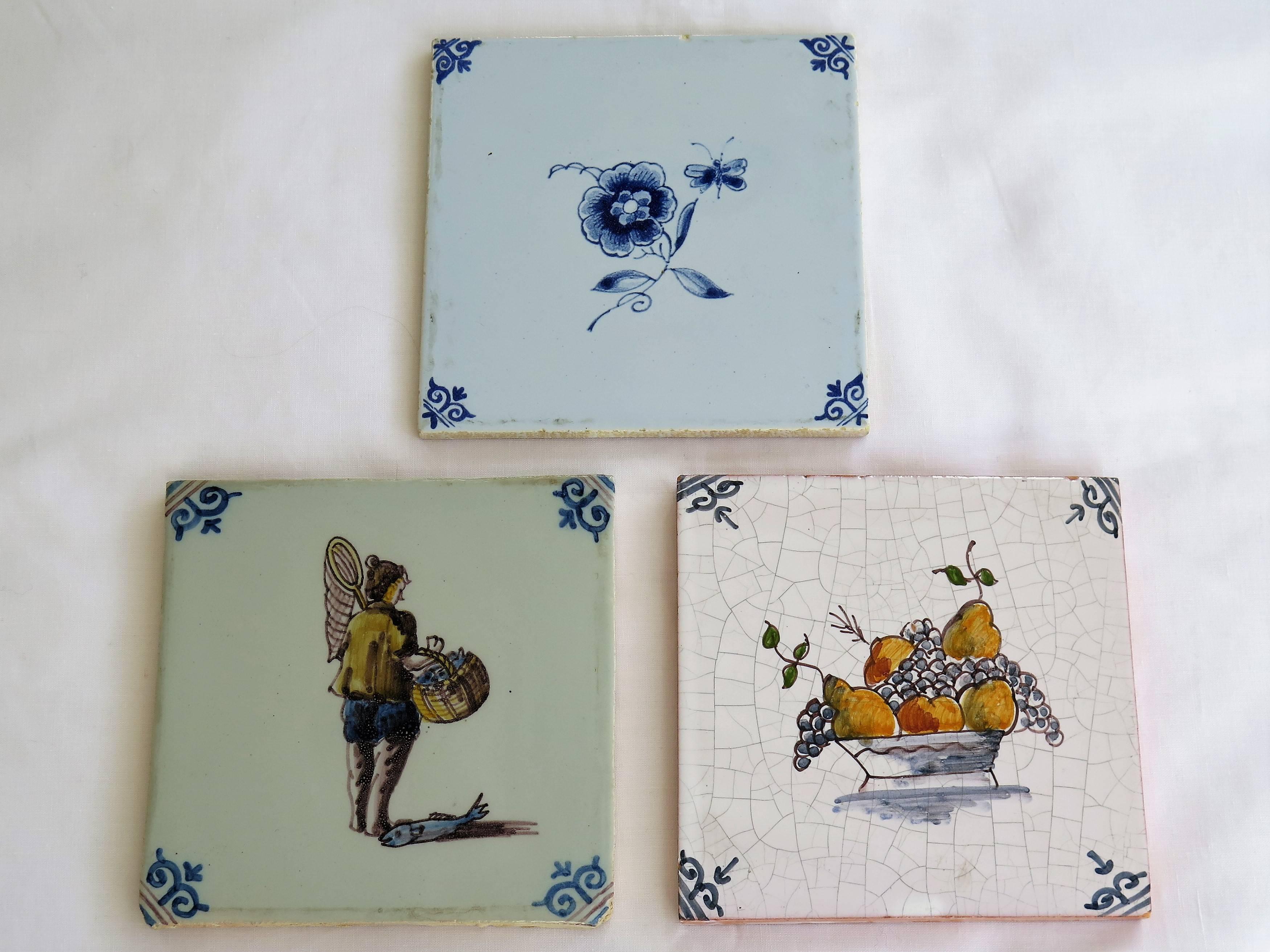These are three attractive Dutch (Netherlands), Delft ceramic wall tiles, the coloured Polychrome ones dating to the 19th century, with the blue and white tile being early / mid 20th Century

All tiles are nominally 5 inches square and 5/16 inches