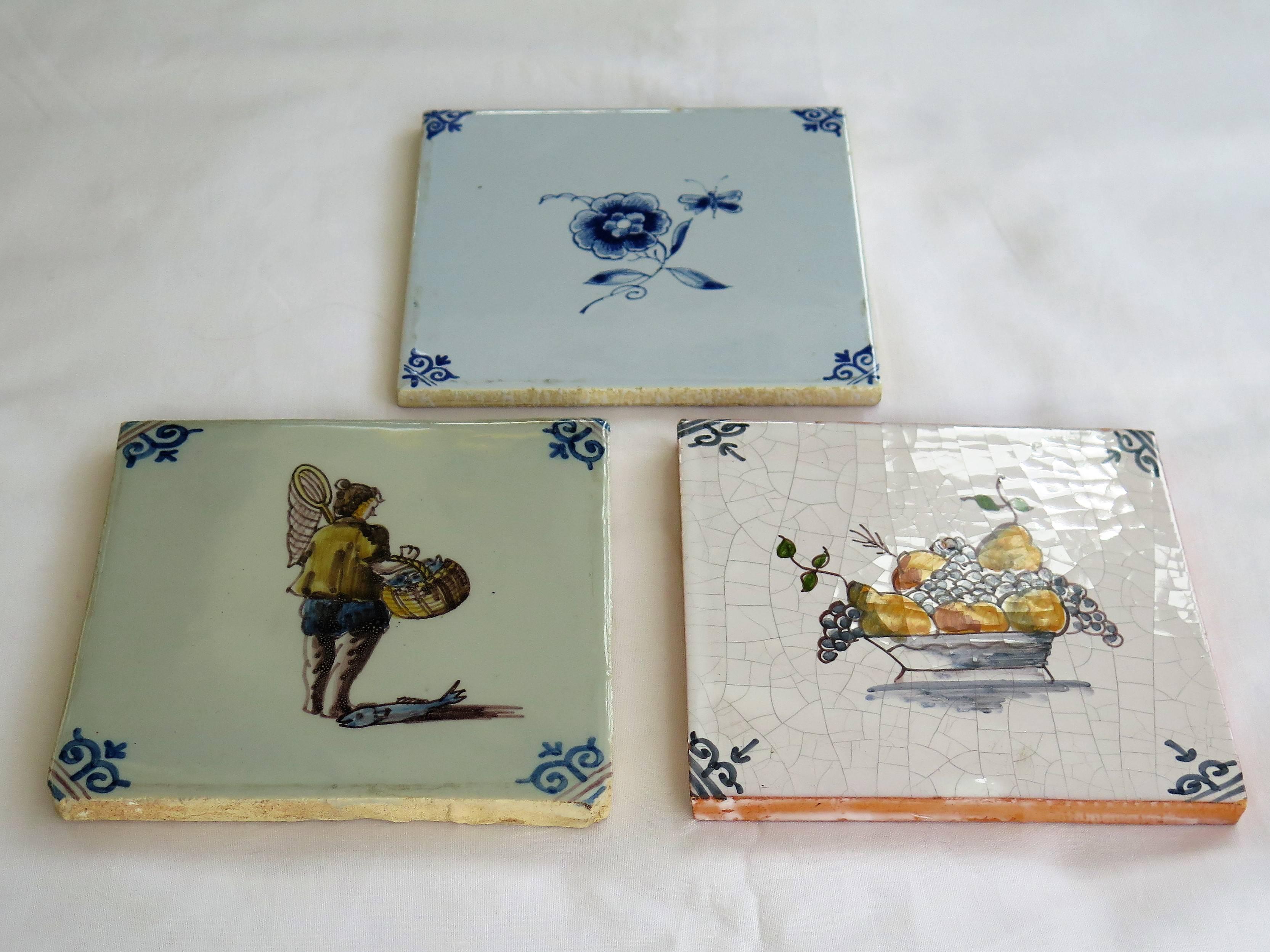 Dutch Colonial Three Ceramic Delft Wall Tiles Fisherman Fruit Bowl and Flowers, Two 19th C 