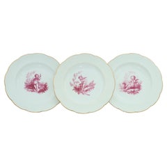 Three cherub decorated plates by Minton