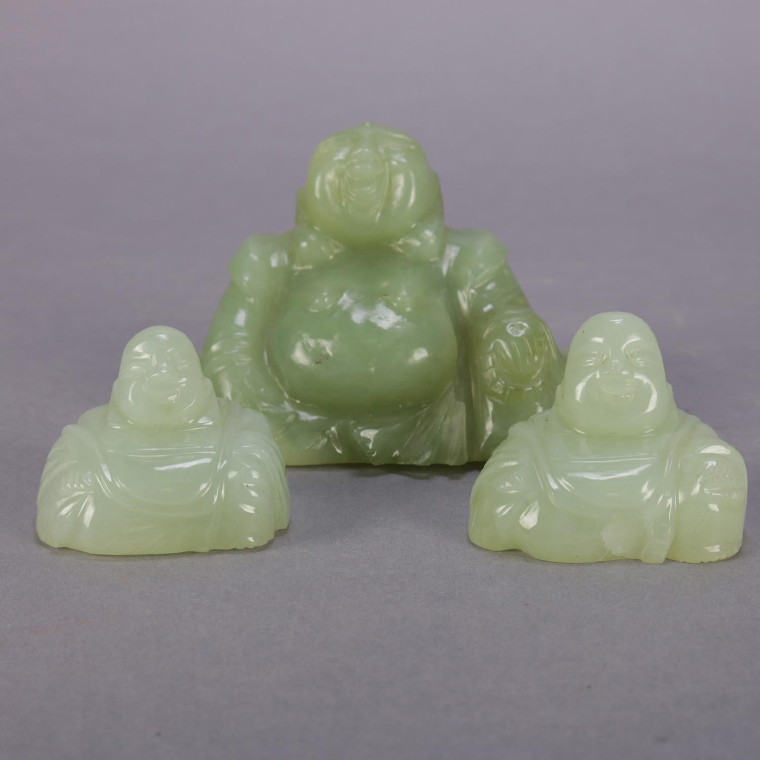 Set of three Chinese carved jade figural sculptures feature seated and laughing buddha, 20th century

Measures: larger 2.75