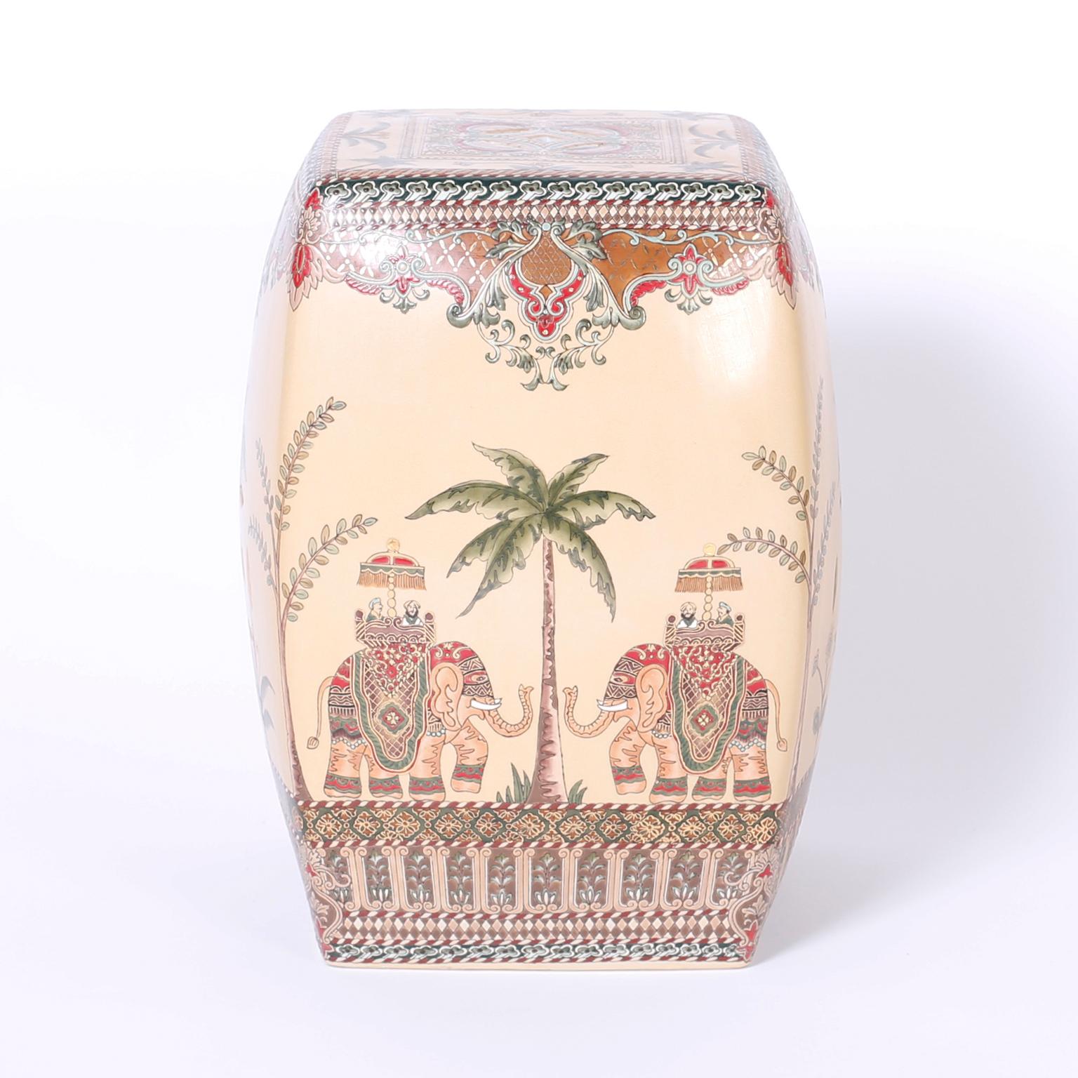 An exotic trio of Chinese terracotta garden seats hand decorated with elaborate floral designs over and under fanciful elephant and palm tree motifs. Priced individually.