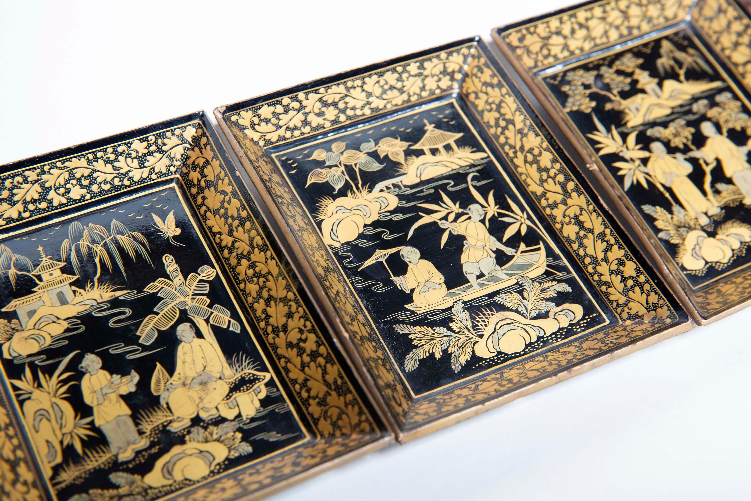 A set of three charming and decorative Chinese export black lacquer trays, exquisitely hand-decorated with chinoiserie motifs on gilt background within oriental foliate borders.
China, Canton, Qing dynasty, 19th century.

Why we like them
Charming