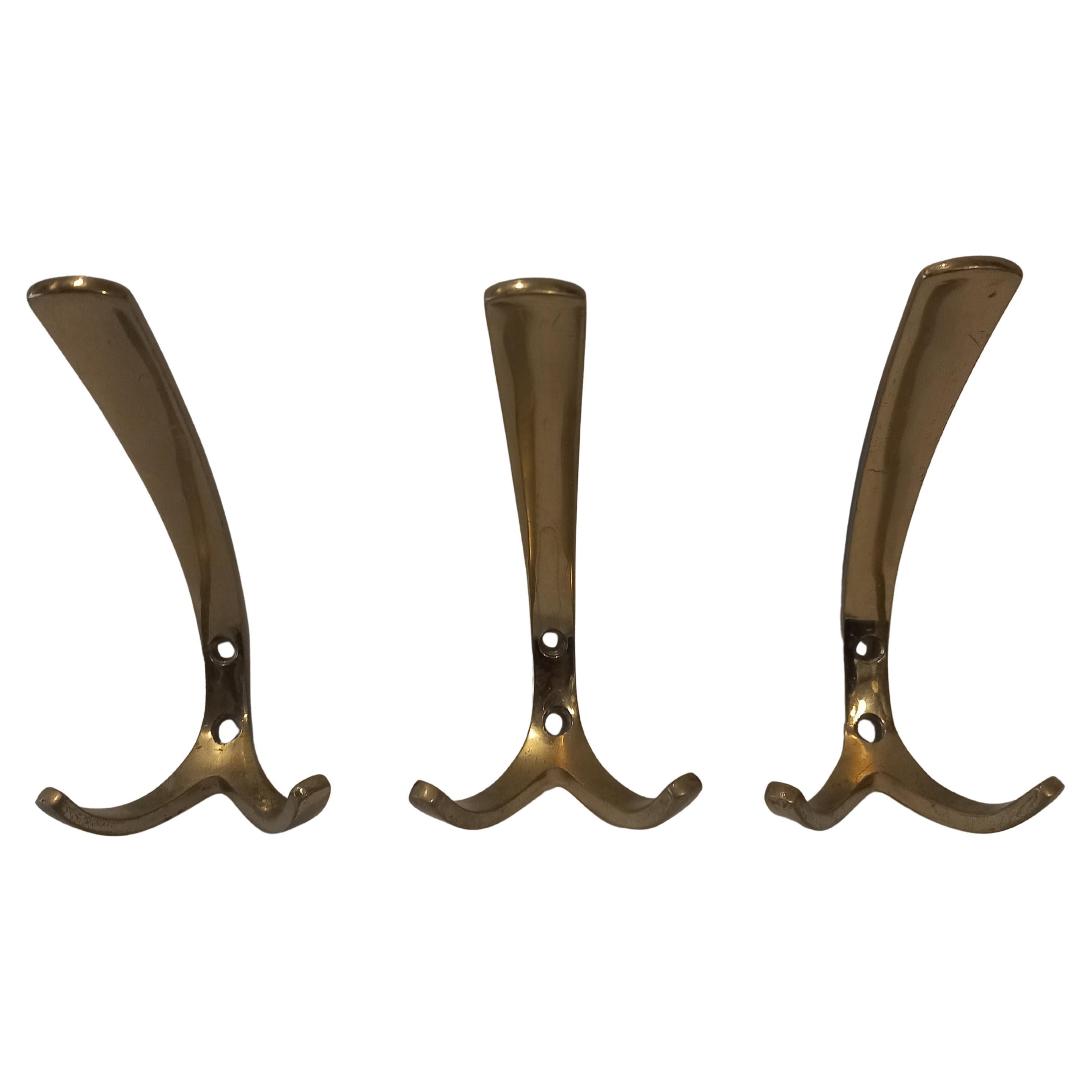 Three coat hooks in the style of Carl Auböck, 1950s
two hooks each; two holes for attaching to the wall; signs of age and wear
good original condition
price per piece, three available