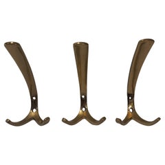 Three coat hooks in the style of Carl Auböck, 1950s