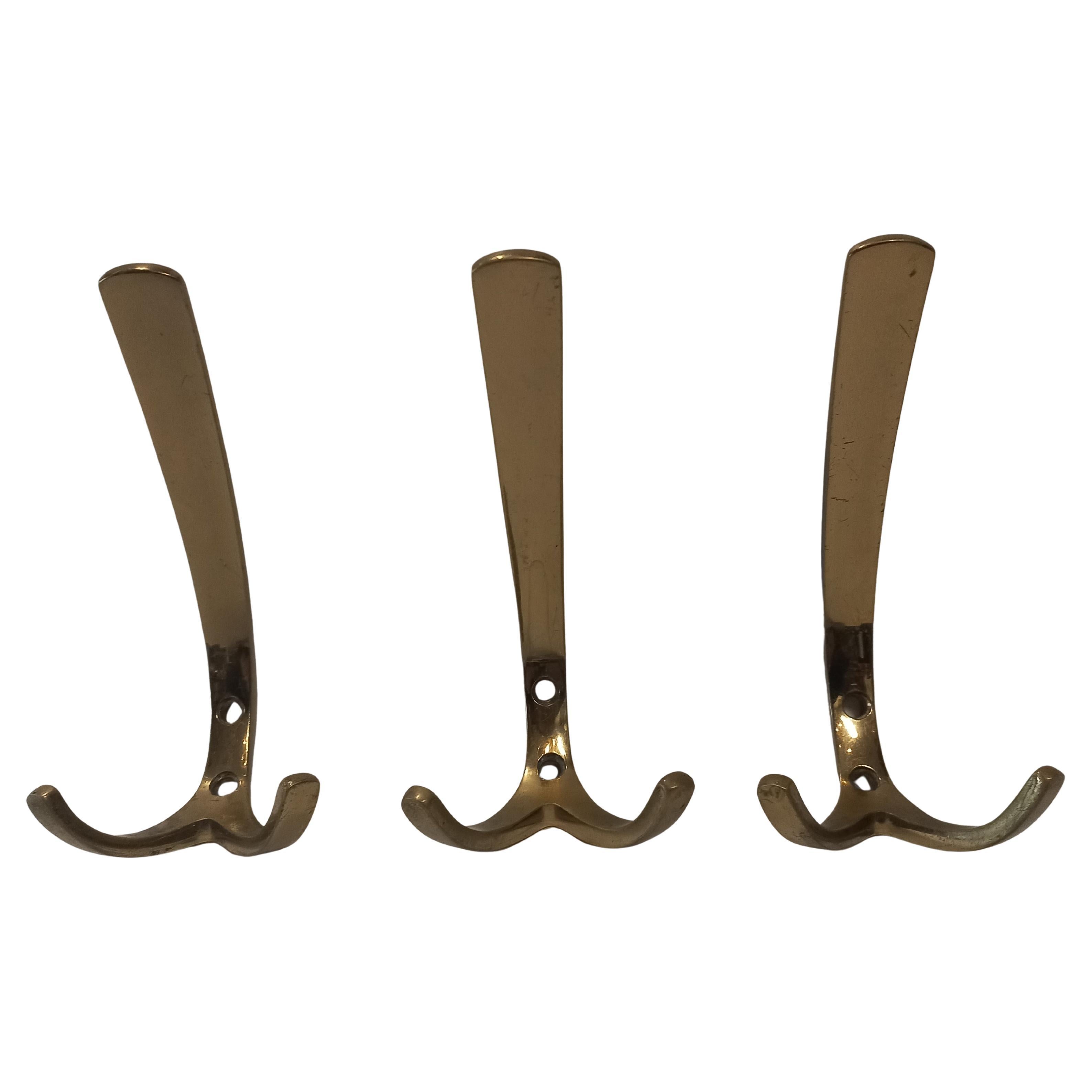 Brass Three coat hooks in the style of Carl Auböck, 1950s For Sale
