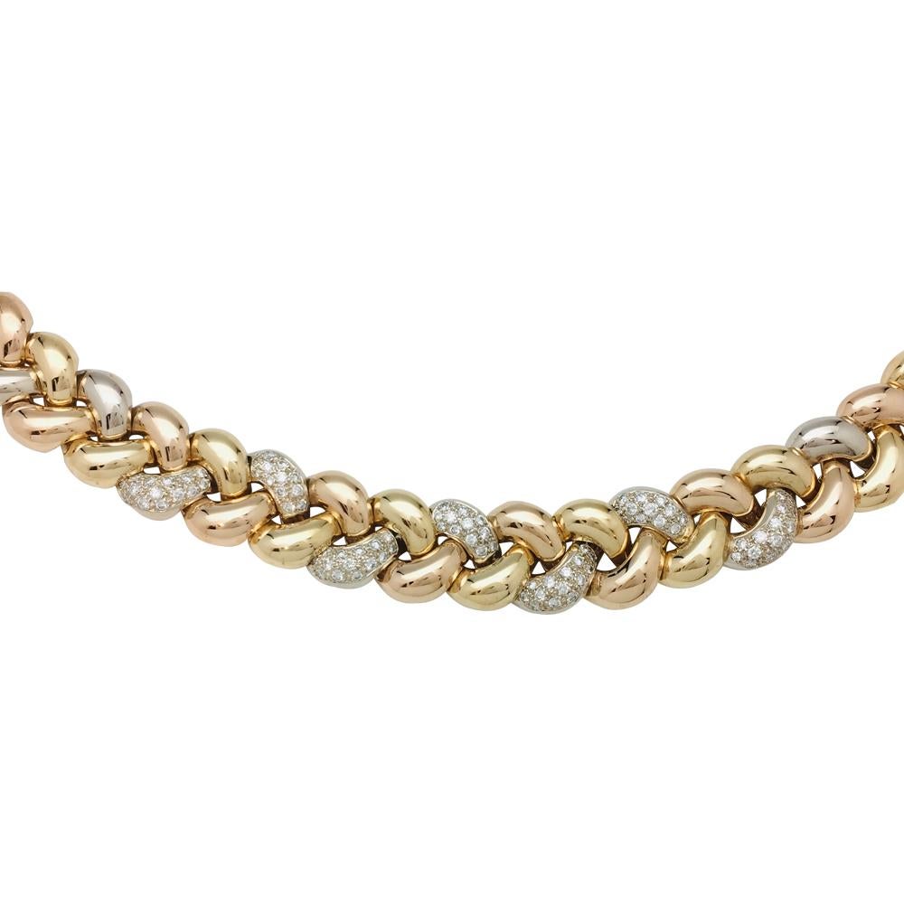 Contemporary Poiray Necklace, three colours of gold designed as a braid with diamonds.