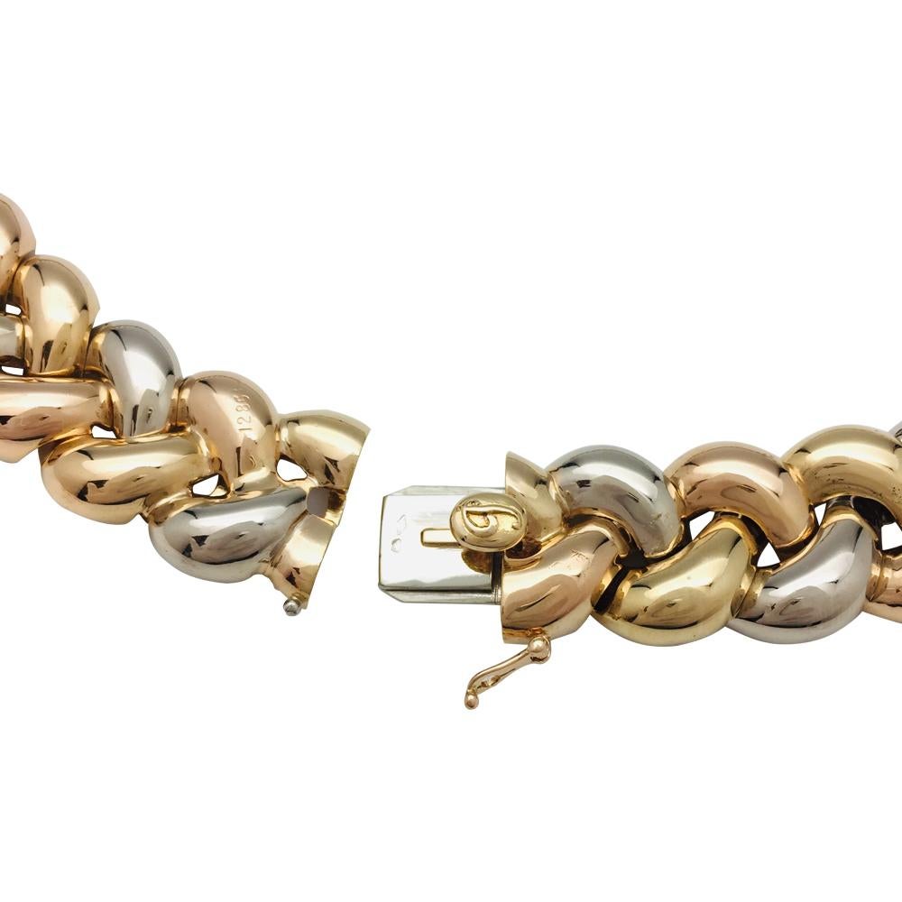 Women's or Men's Poiray Necklace, three colours of gold designed as a braid with diamonds.
