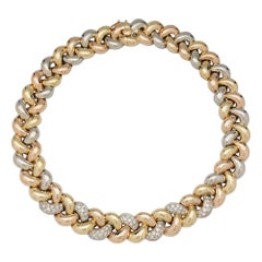 Vintage Poiray Necklace, three colours of gold designed as a braid with diamonds.