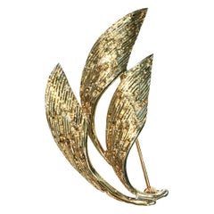 Spilla a tre foglie curve in oro giallo 14 carati