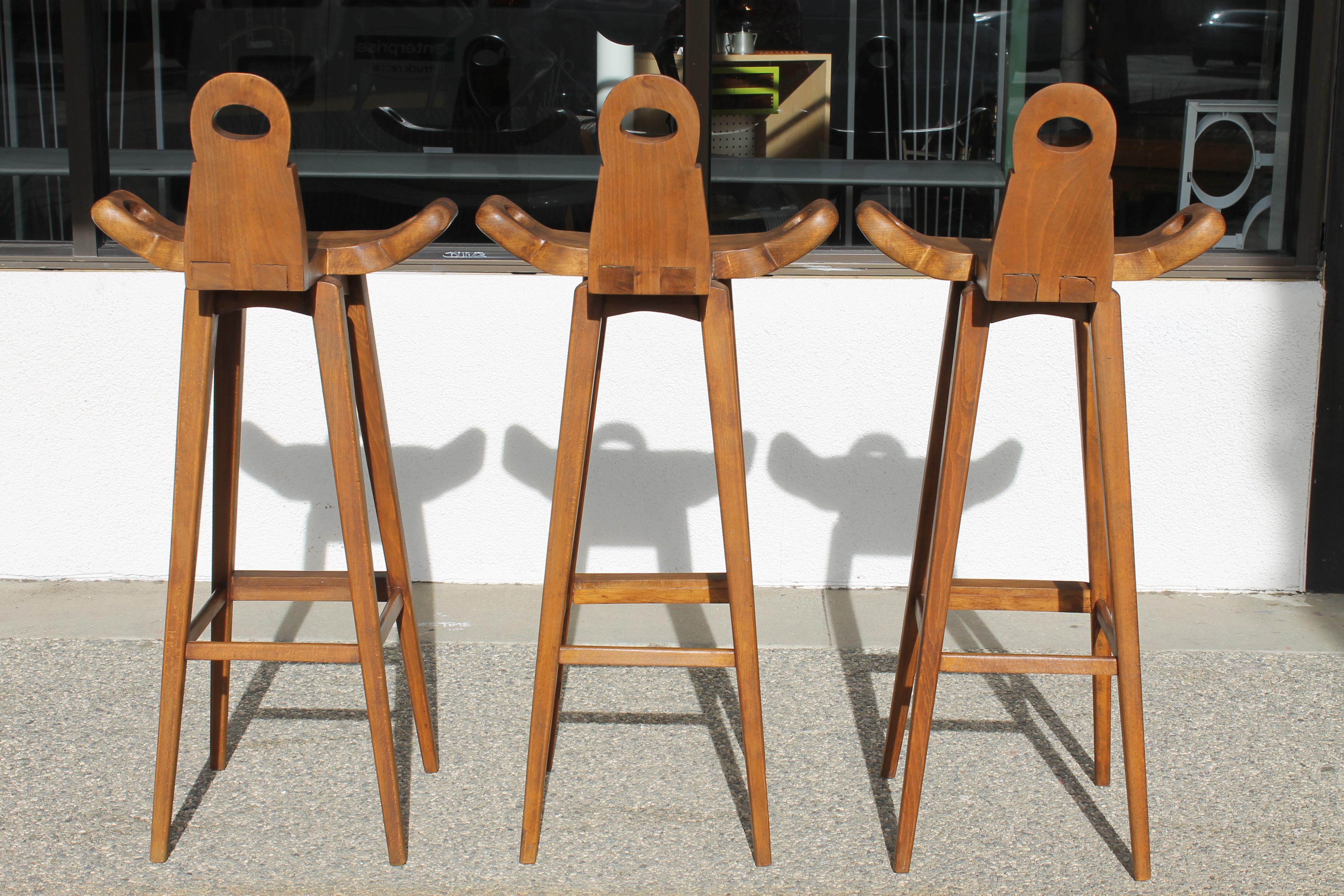 Set of three studio made bar stools. Stools measure 19.25