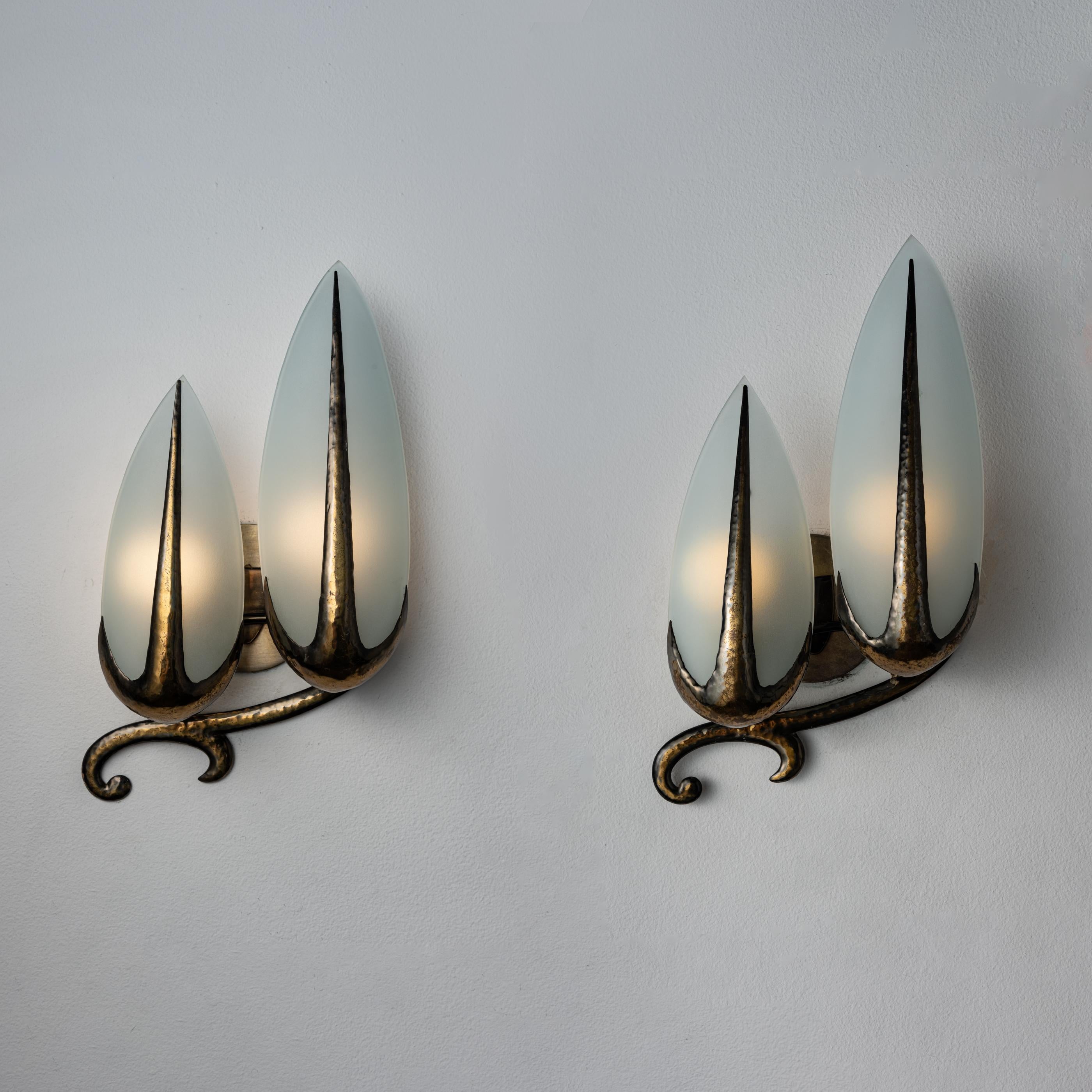 Single Custom Italian Mfg. sconce. Manufactured in Italy, circa 1940's. Brass and opaline glass. Rewired for U.S. standards. Custom brass backplates. We recommend two E14 candelabra bulbs per fixture. Bulbs not included. Priced and sold