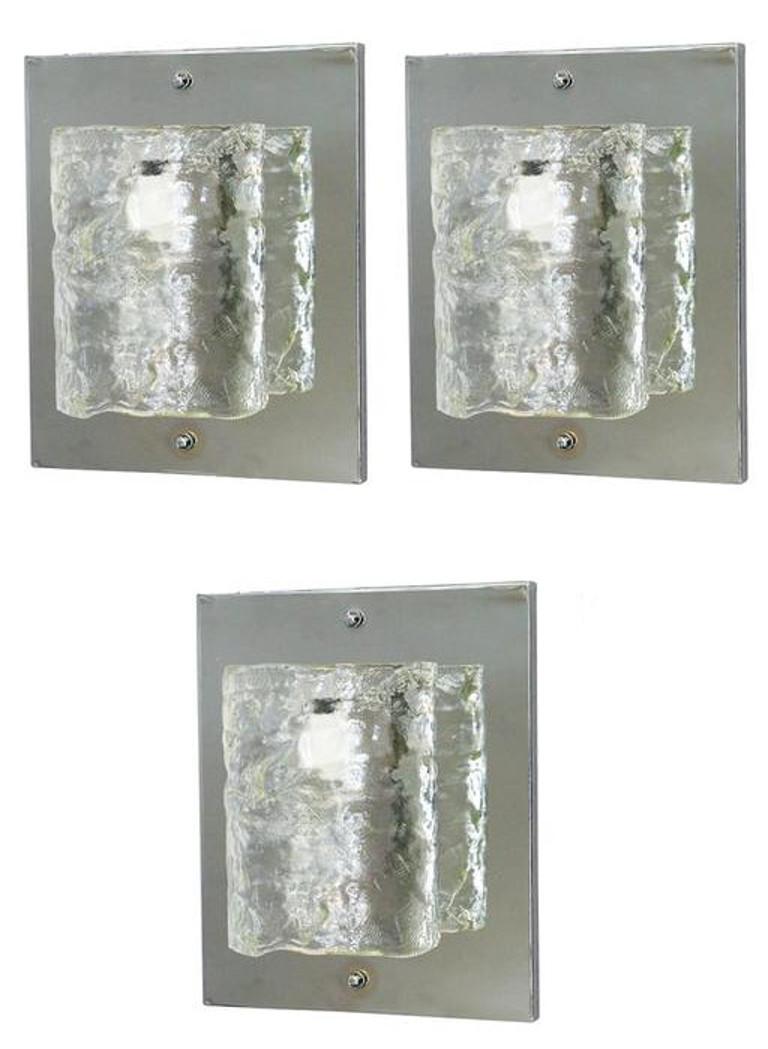 Vintage Italian wall lights with hand blown textured clear Murano glass cylinders mounted on chrome frames / Designed by Mazzega, circa 1960’s / Made in Italy
1 light / E26 or E27 / max 60W each
Height: 15 inches / Width: 12.5 inches / Depth: 6