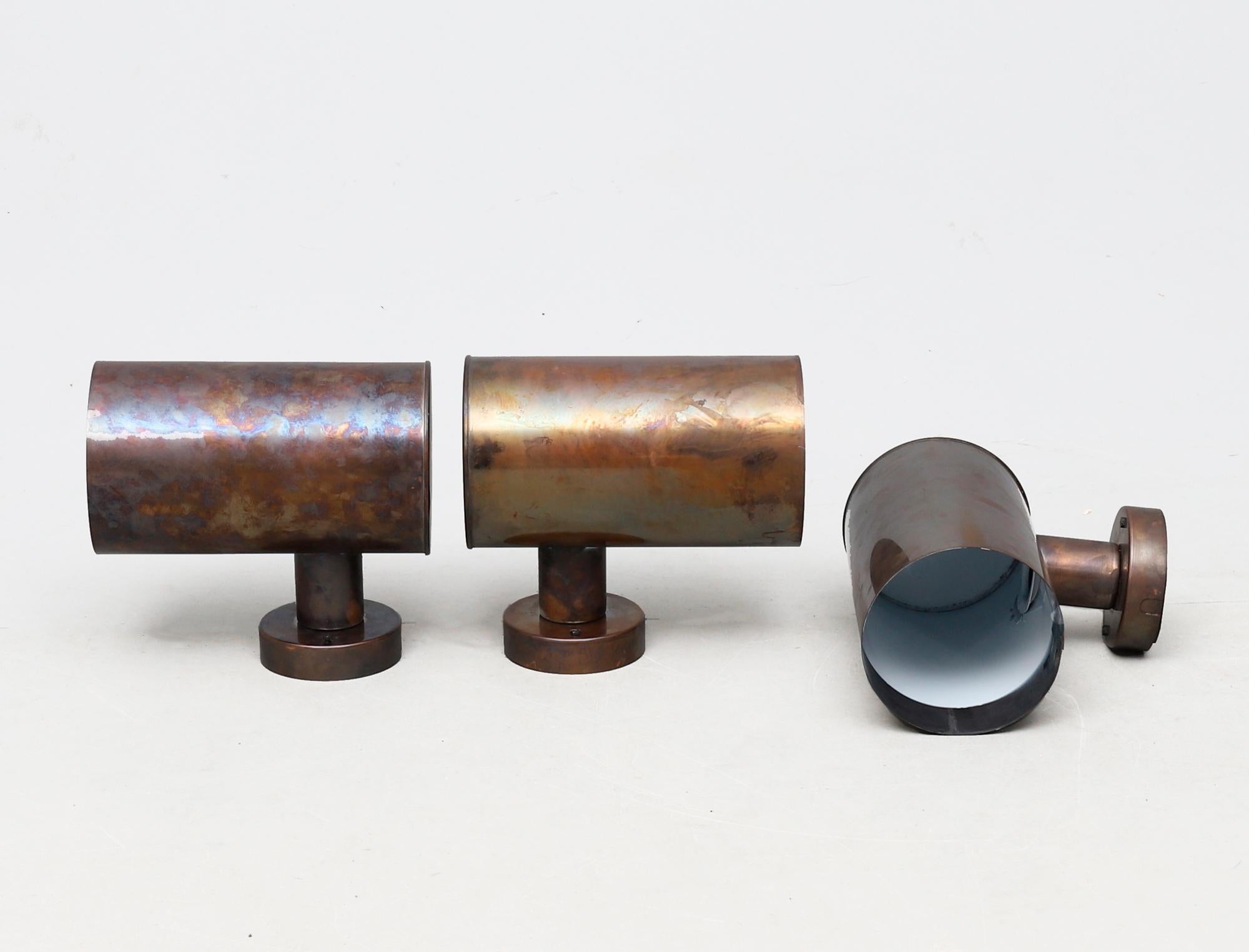 Three cylindrical outdoor Scandinavian Modern wall lamps by Fagerhults, Sweden. Made of copper with and has a beautiful patina.
Please note: Listed price is for one (1) wall lamp.