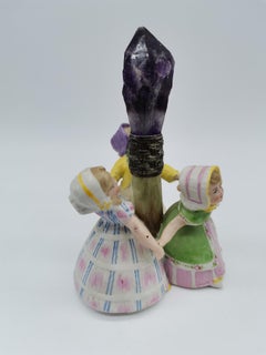 Three dancing girls made of porcelain around the turn of the century