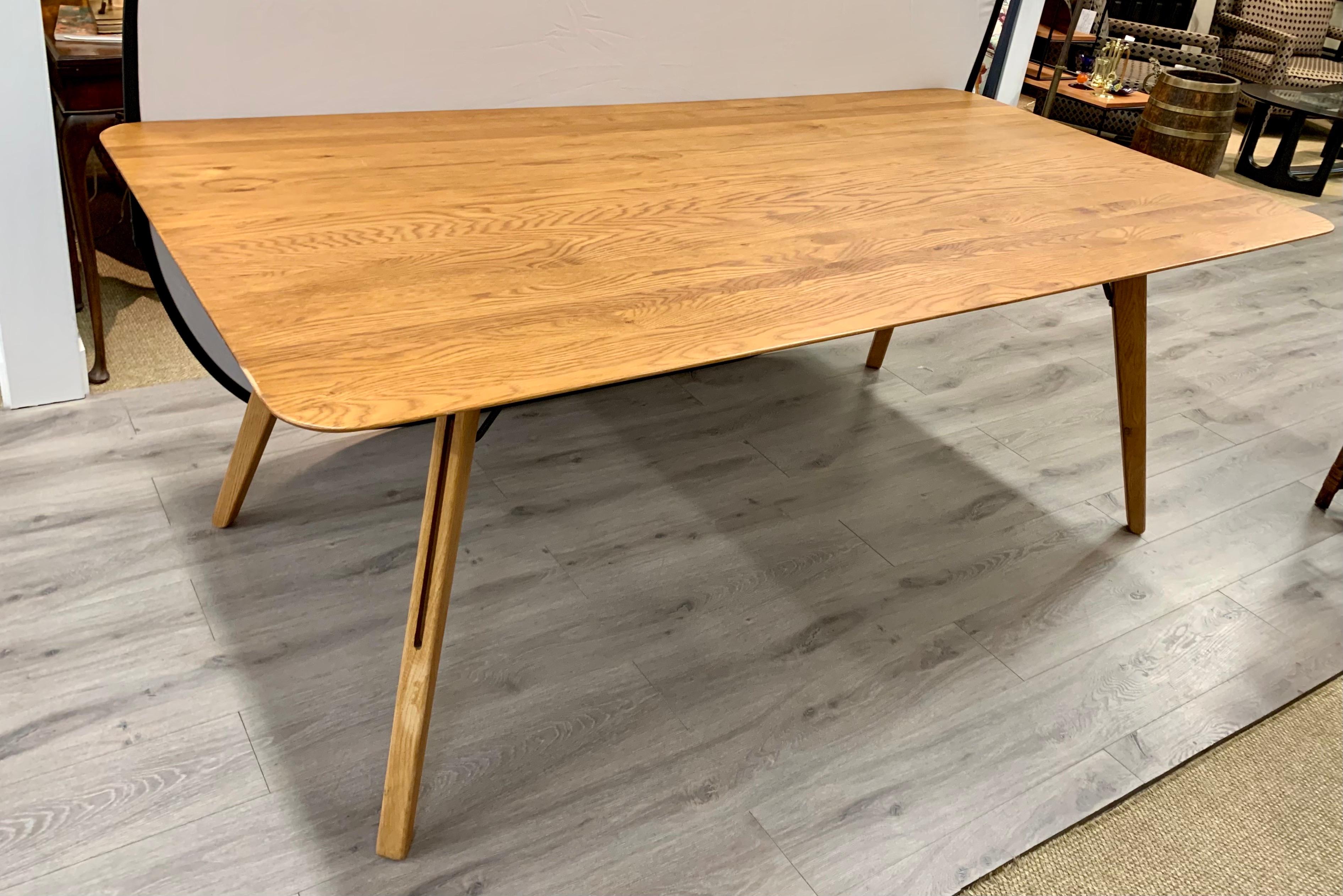 Iconic set of three matching Danish modern sleek oak dining tables with great scale and better lines. Multipurpose - can be used as a writing table too. Now more than ever, home is where the heart is.