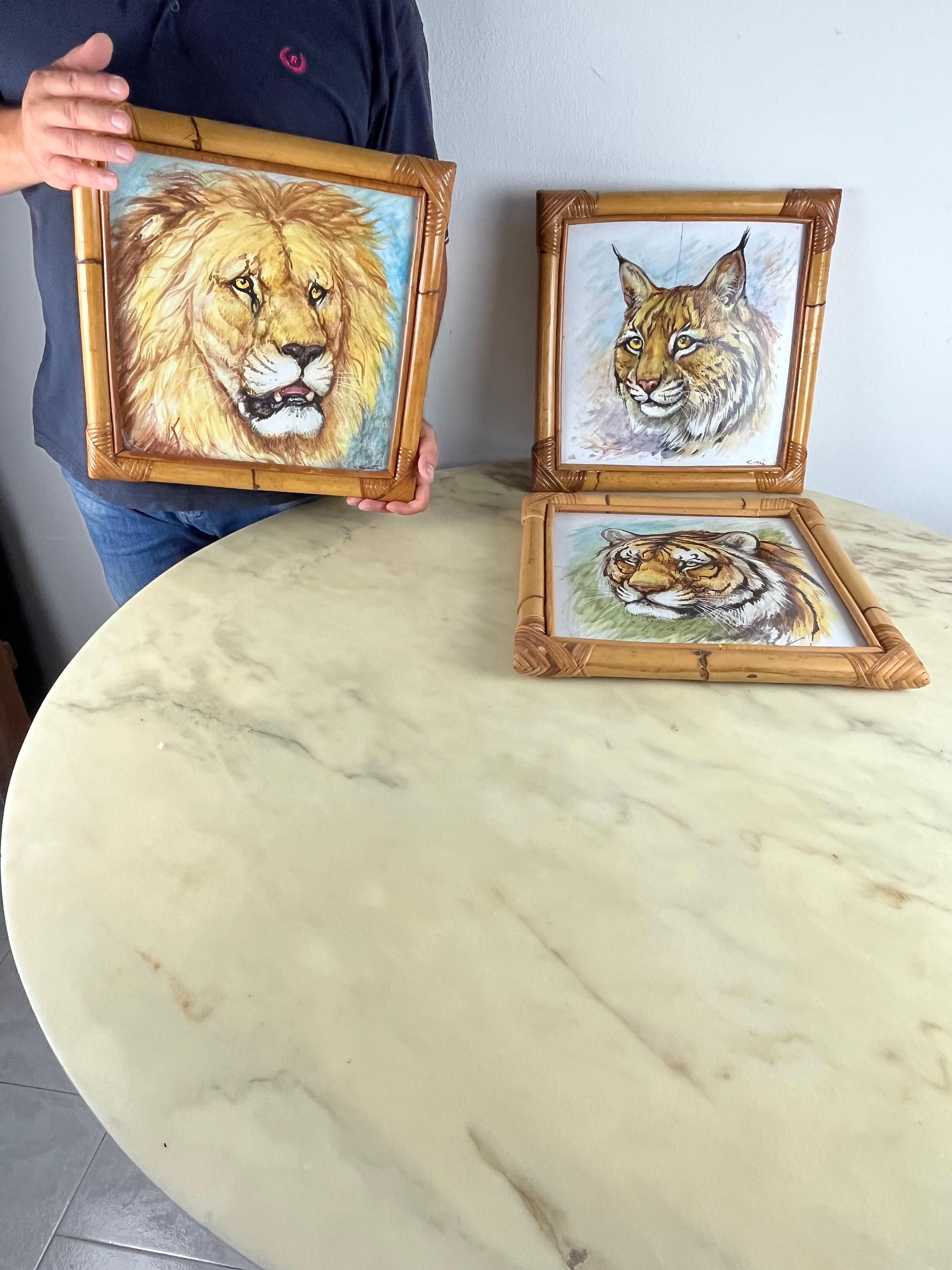 Three decorated ceramics with bamboo frame, Italy, 1970s
The three ceramics depict a lynx, a tiger and a lion. Two have breaks, not very visible; One intact. 40cm x 40cm.