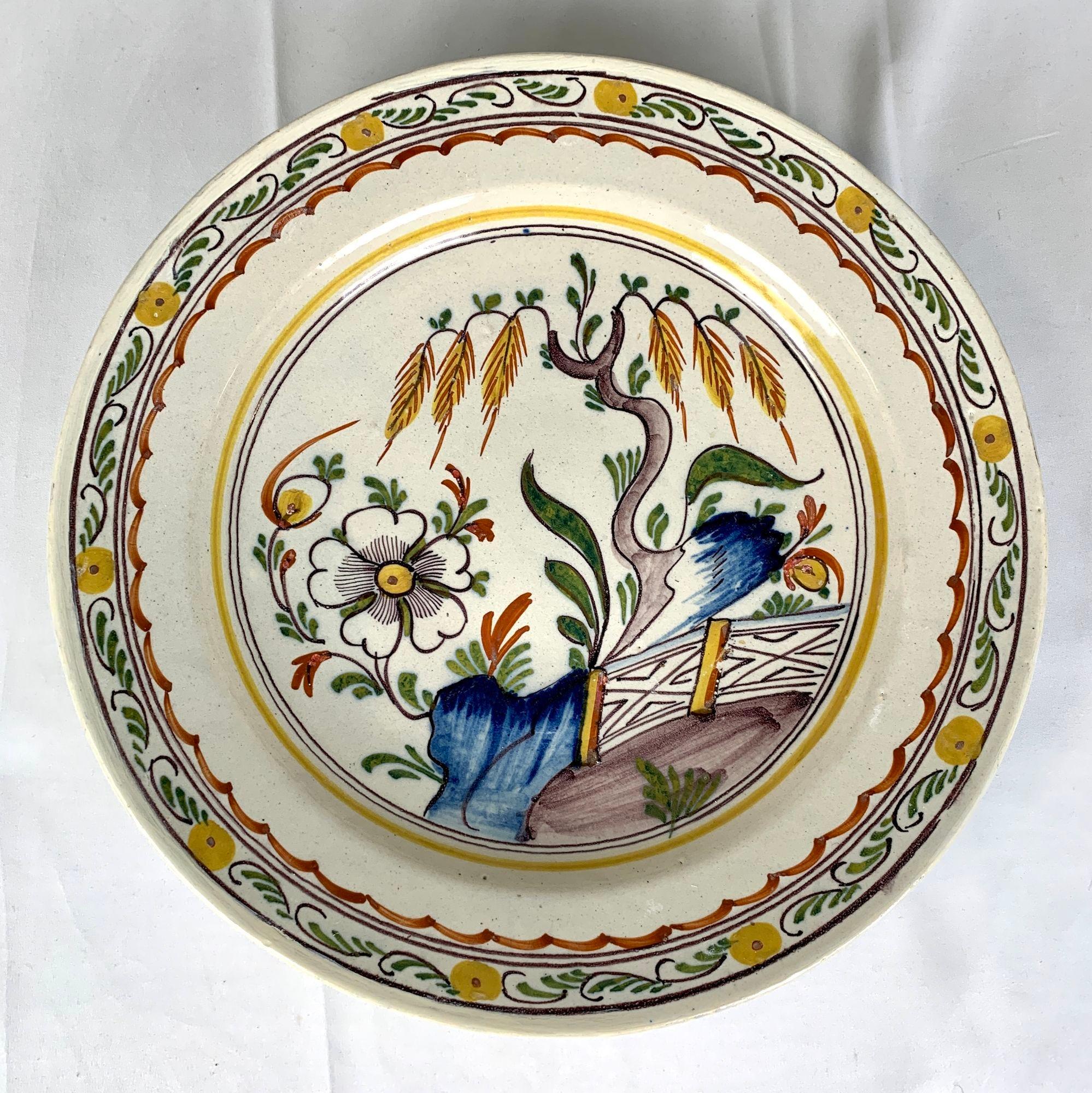 This collection of three antique Dutch Delft chargers showcases the craftsmanship of the 18th-century potteries in the city of Delft.
Each charger is hand painted in a vibrant array of polychrome hues, including cobalt blue, green, yellow, iron red,
