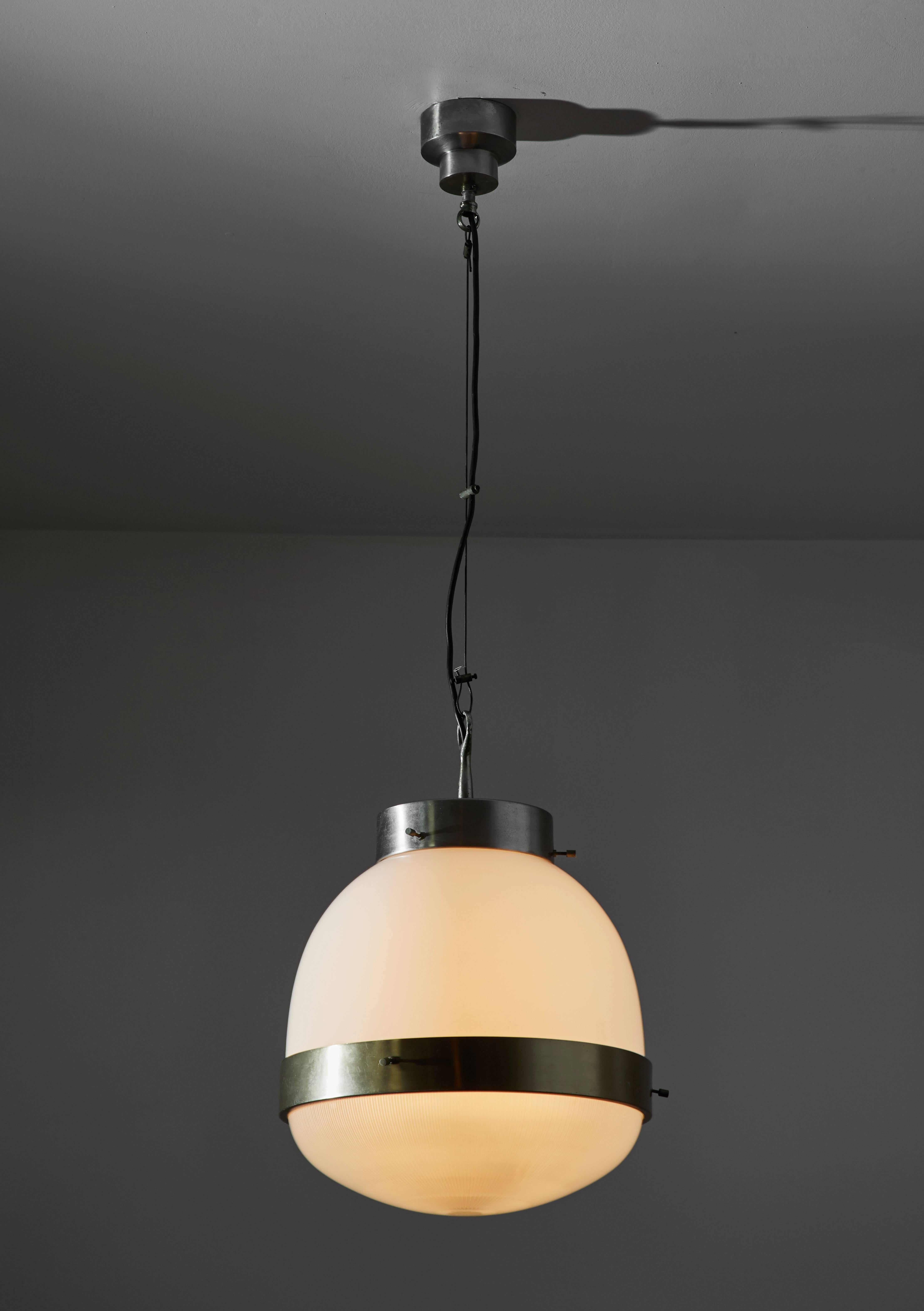 Three Delta Grande suspension lamps by Sergio Mazza for Artemide. Designed and manufactured in Italy, circa 1960s. Brass and opaline glass fix shade with Holophane glass diffusers. Wired for US junction boxes. Each light takes one E27 100w maximum