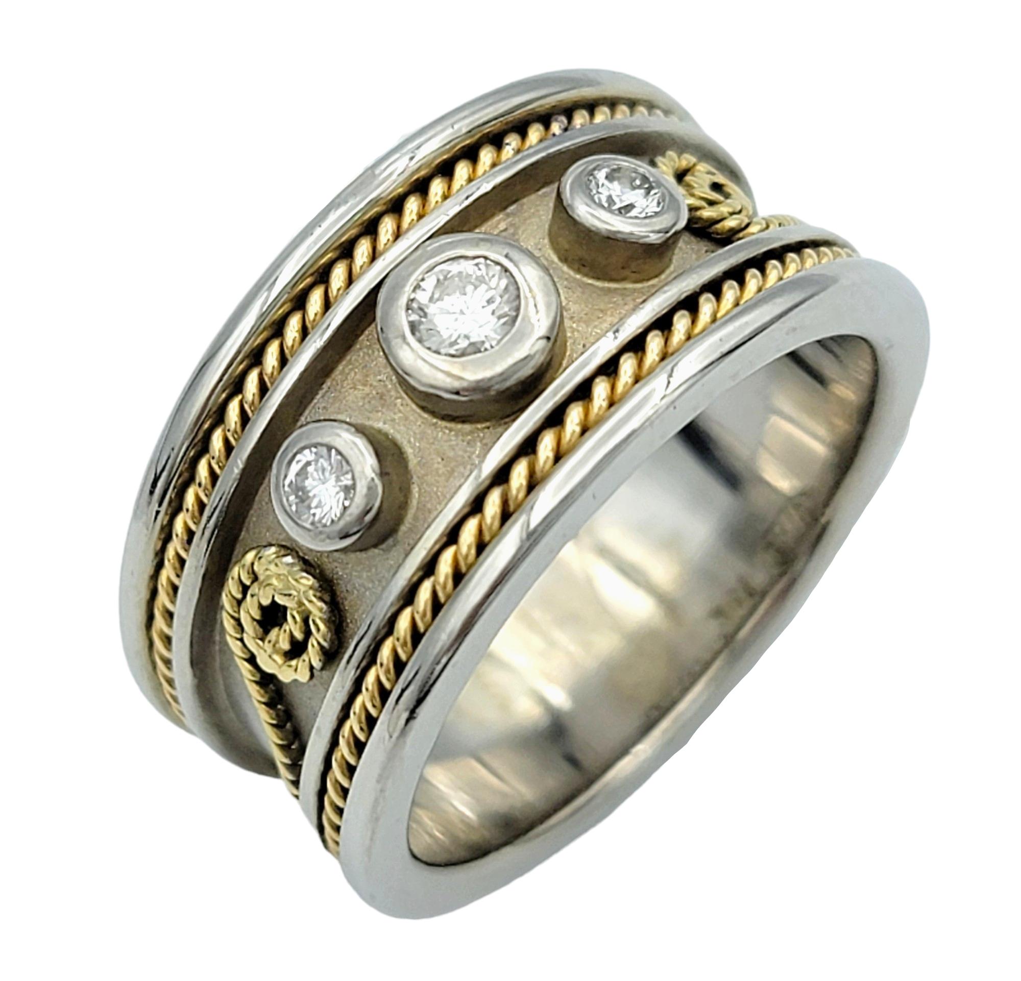Ring Size: 9.5

This exquisite diamond band ring showcases a beautiful scroll-like design, meticulously crafted in 18 karat yellow and white gold. The scroll motif adds an elegant and ornate touch to the ring, giving it a timeless and sophisticated