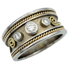 Three Diamond Band Ring with Twisted Scroll Motif in Two-Toned 18 Karat Gold
