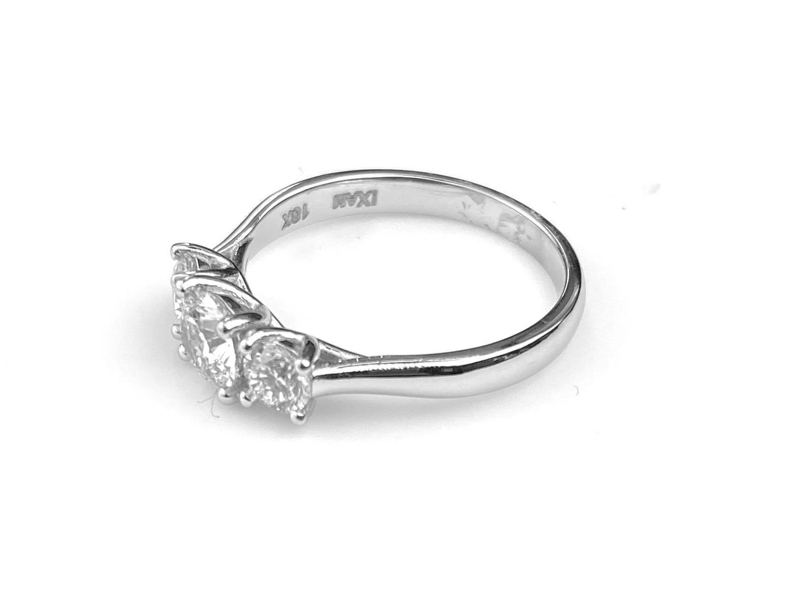 Contemporary Three-Diamond Ring with 0.60 Carat Center Diamond in White Gold For Sale