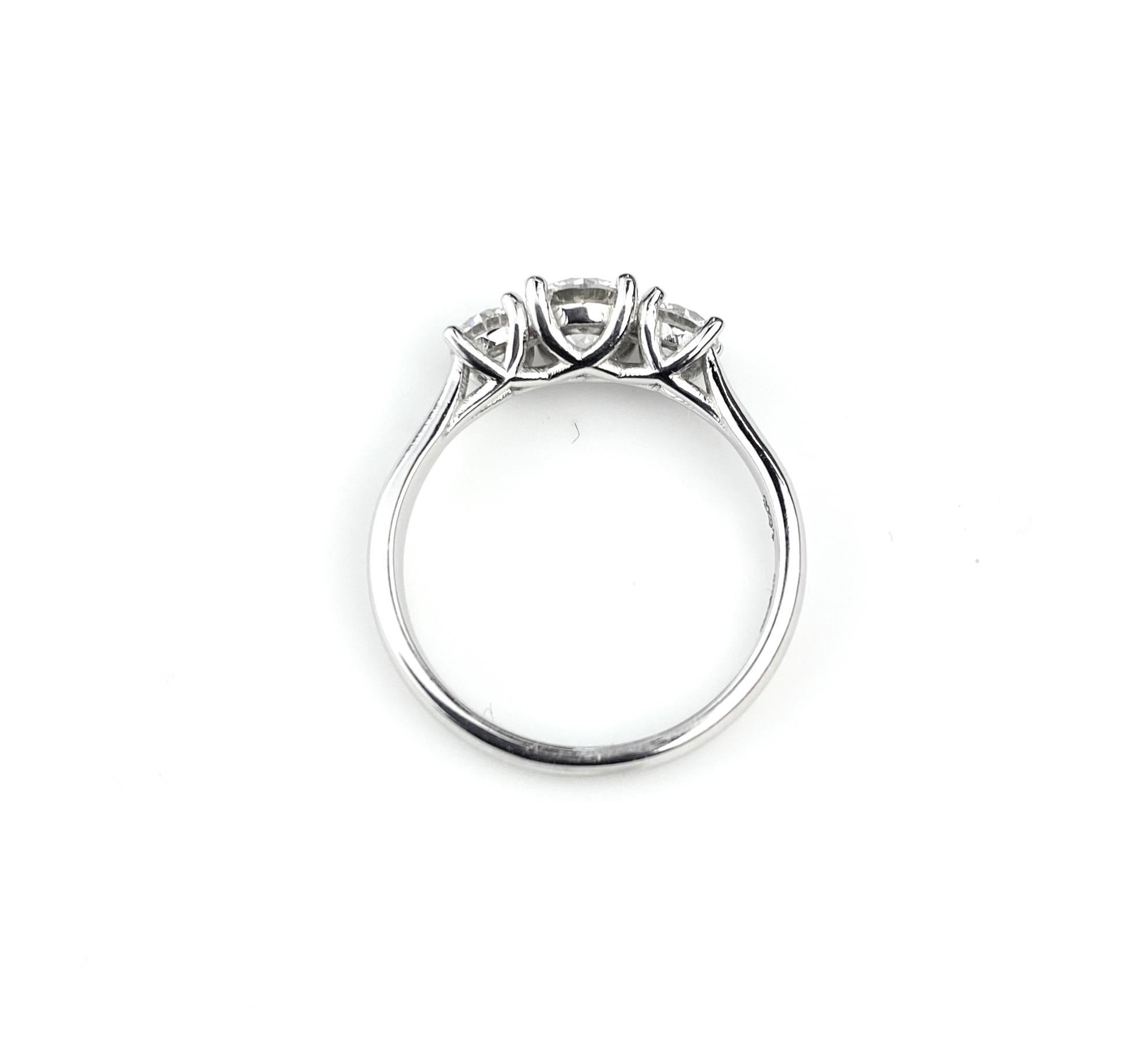 Round Cut Three-Diamond Ring with 0.60 Carat Center Diamond in White Gold For Sale