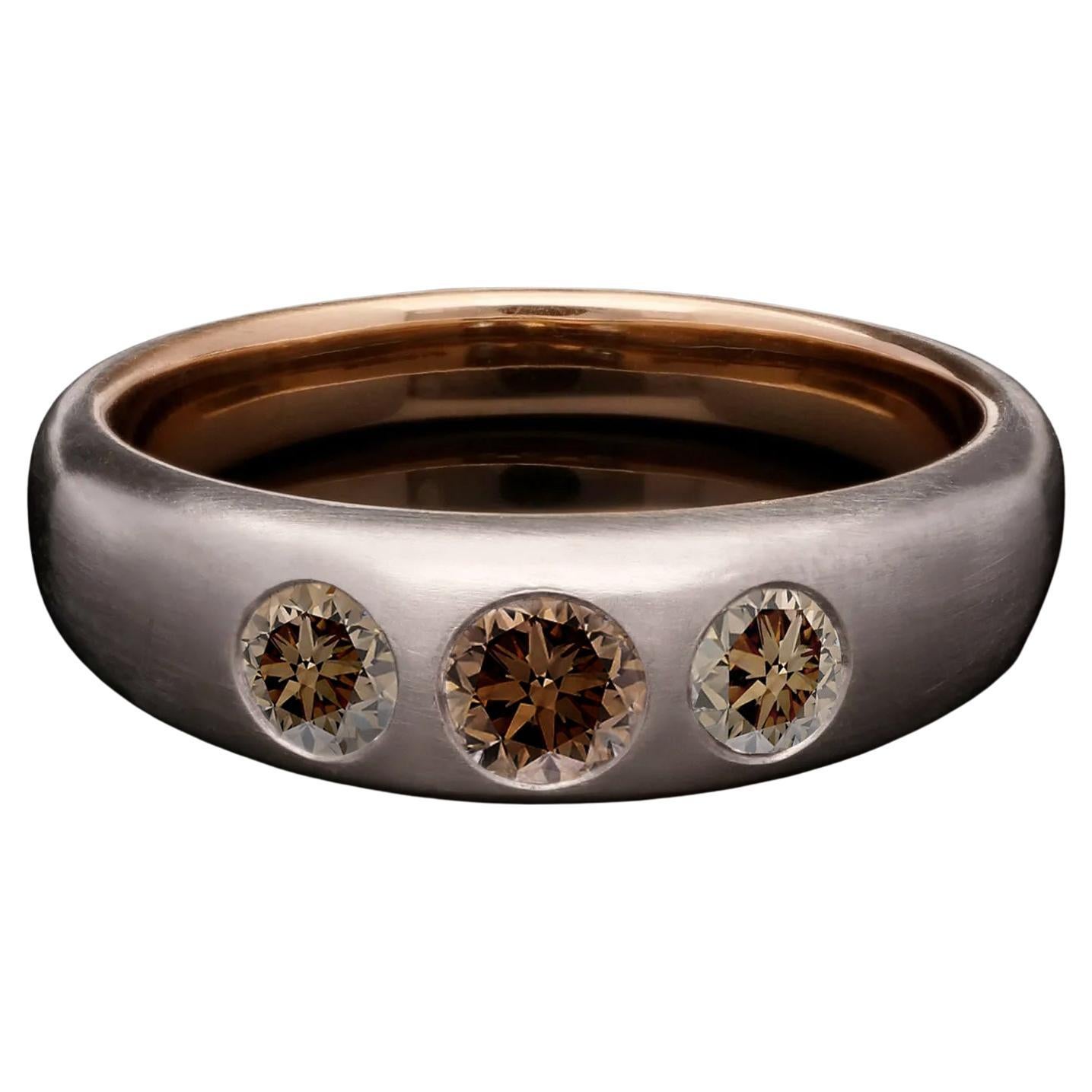 0.71, 0.69 and 0.63 carat Fancy Brown Diamonds three tones color on Gold 18K Ring.
Size upon request.