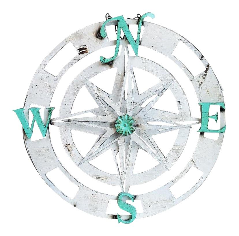 Three dimensional compass with rotating star. This item is believed to be part of a clock and is now used as a wall ornament. H 24 in. x W 2 in. x D 24 in.