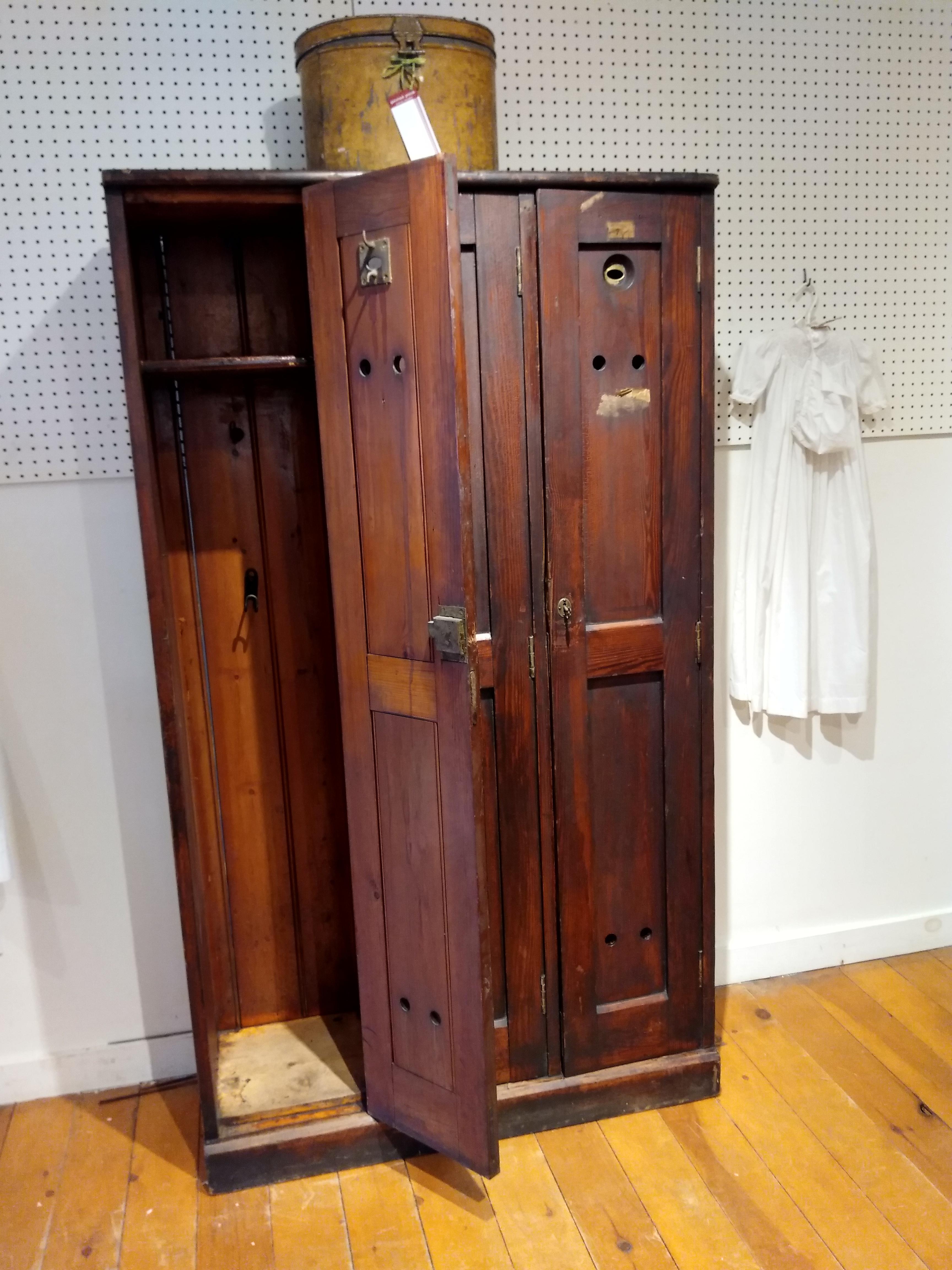 Our wooden golf locker, circa 1870, came from a country club in the Northern UK. It still has some numbers and labels of member names on the doors. Inside there are hooks and one shelf in each locker -- along with small metal troughs and umbrella