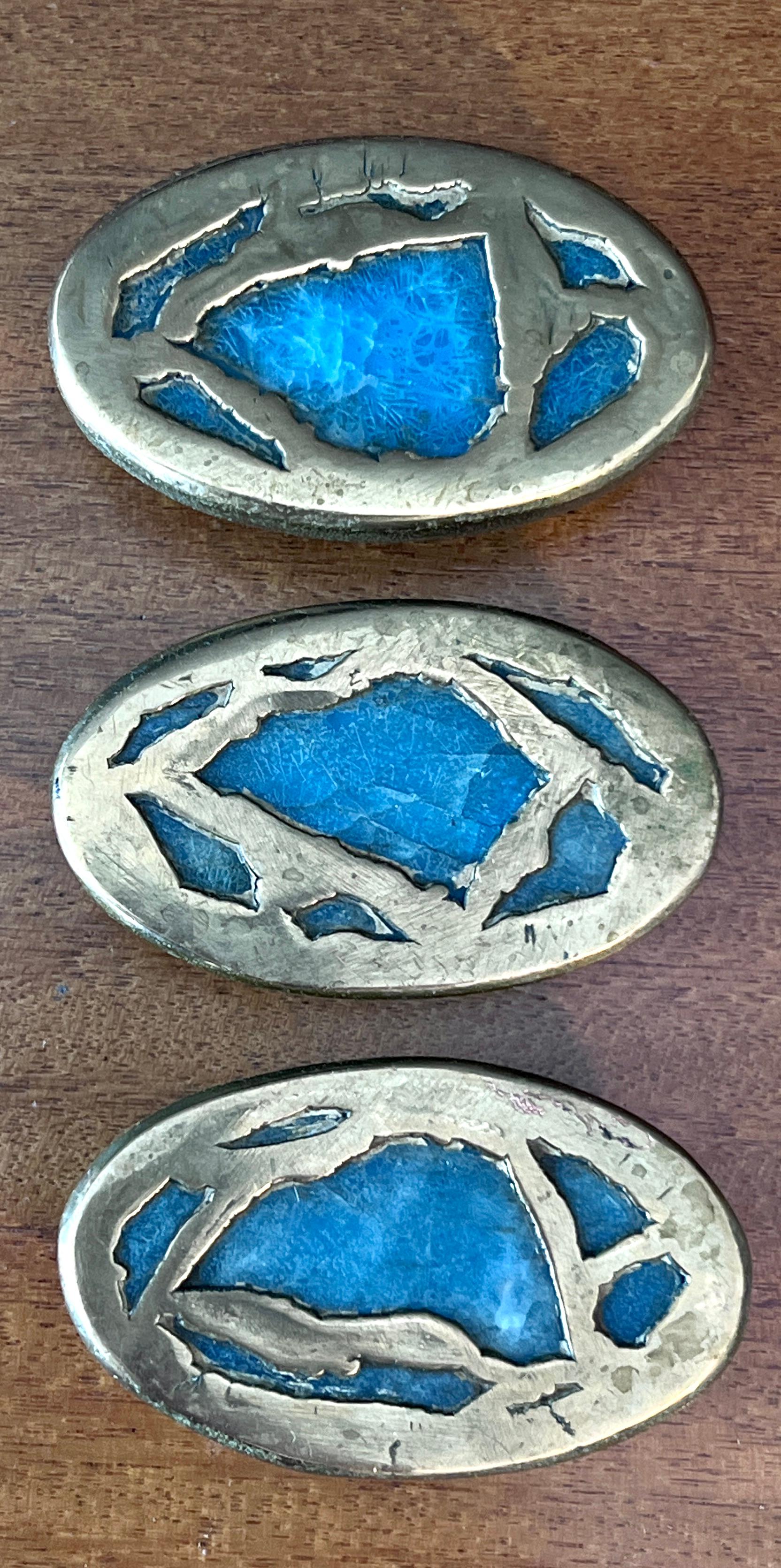 A set of three bronze and stone door or drawer pulls by Mexican artisan Pepe Mendoza.  

The three also have a round door pull, shown I one image, however sold separately.

The trio would be wonderful on an existing or new piece of furniture.  The