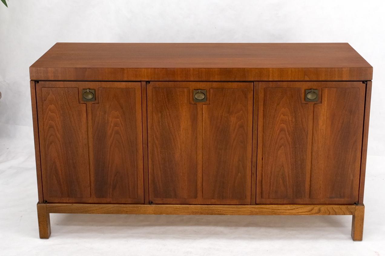 Mid-Century Modern walnut three doors two fitted drawers server sideboard credenza. Super clean compact cabinet with silverware storage.