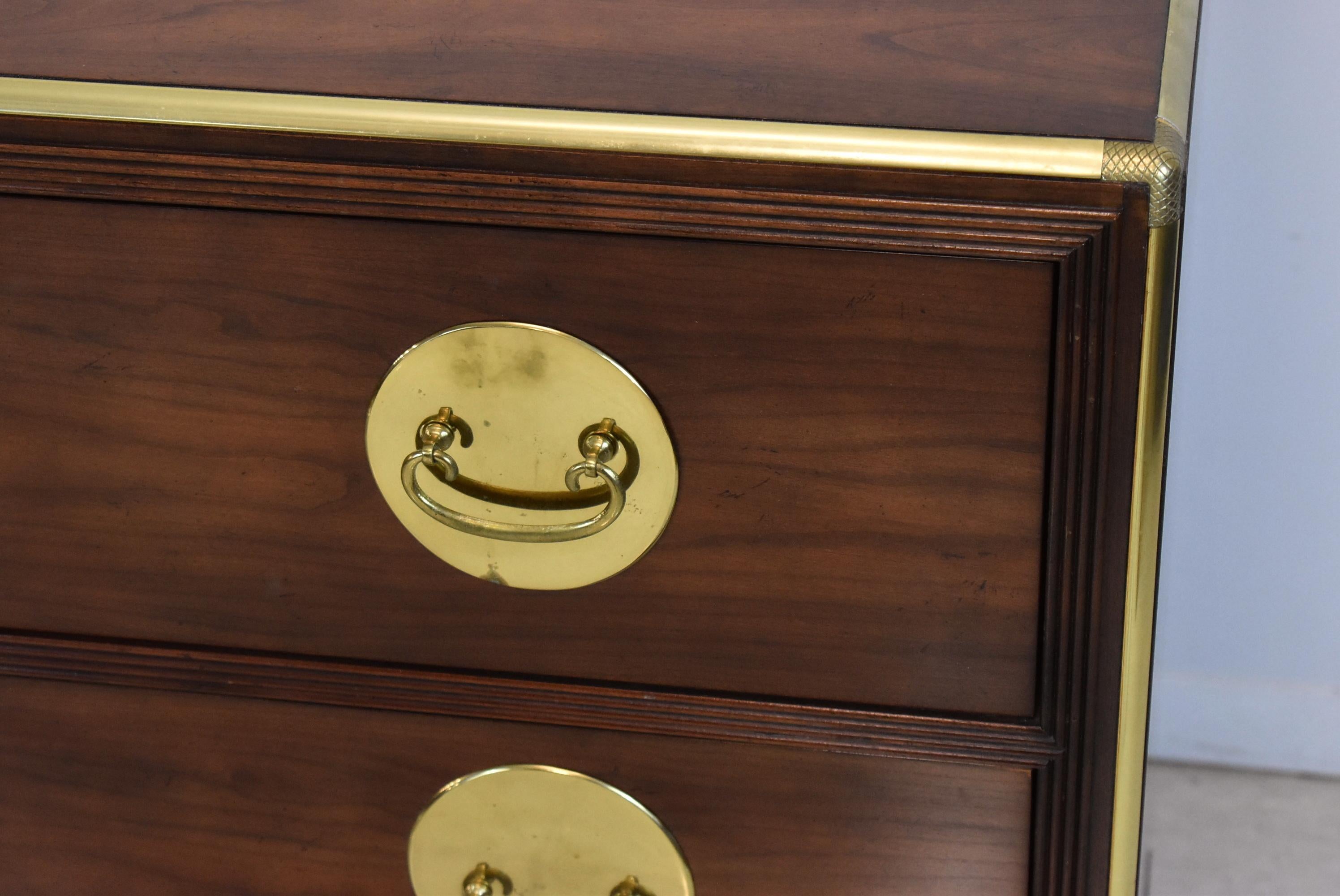 Three drawer Asian style cherry chest by Baker Furniture Company. T-drawers have dovetail construction with brass hardware. Minor wear to the top. 38